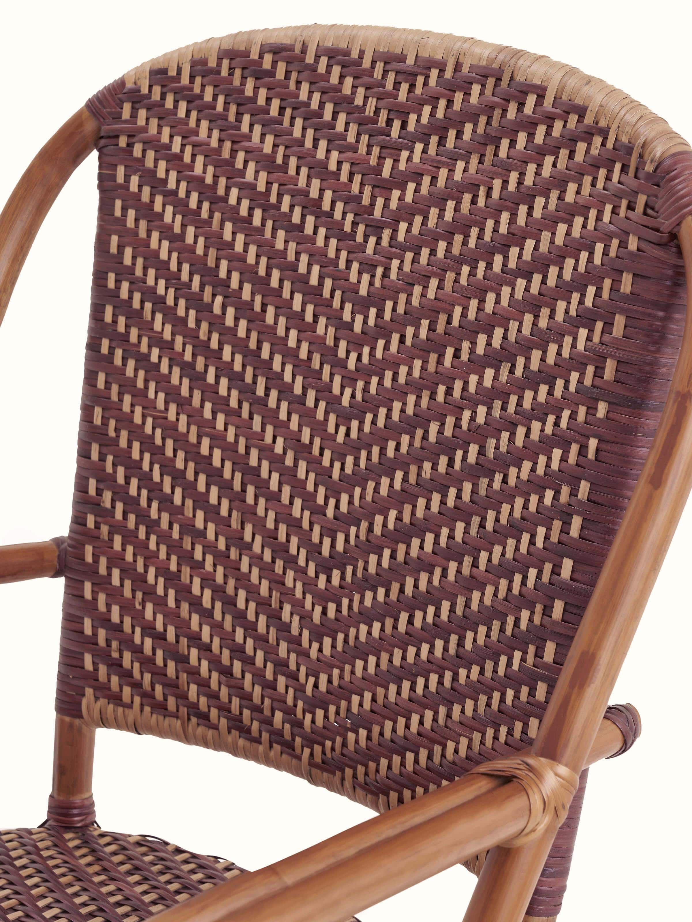 Detailed view of the cane patio chair’s backrest, emphasizing the quality of the cane weaving