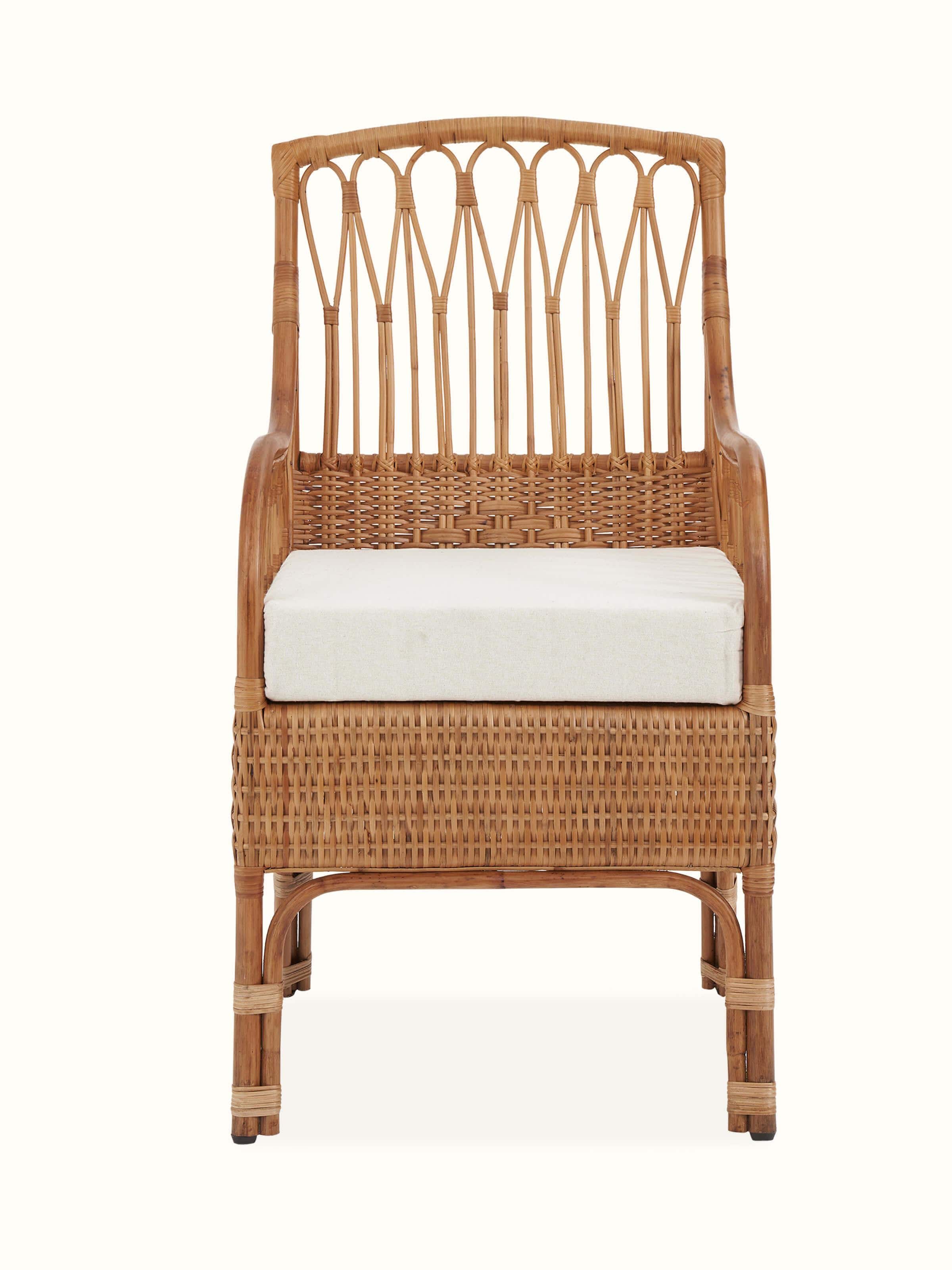 Front view of the upholstered cane study chair, highlighting the elegant design and comfortable upholstery.