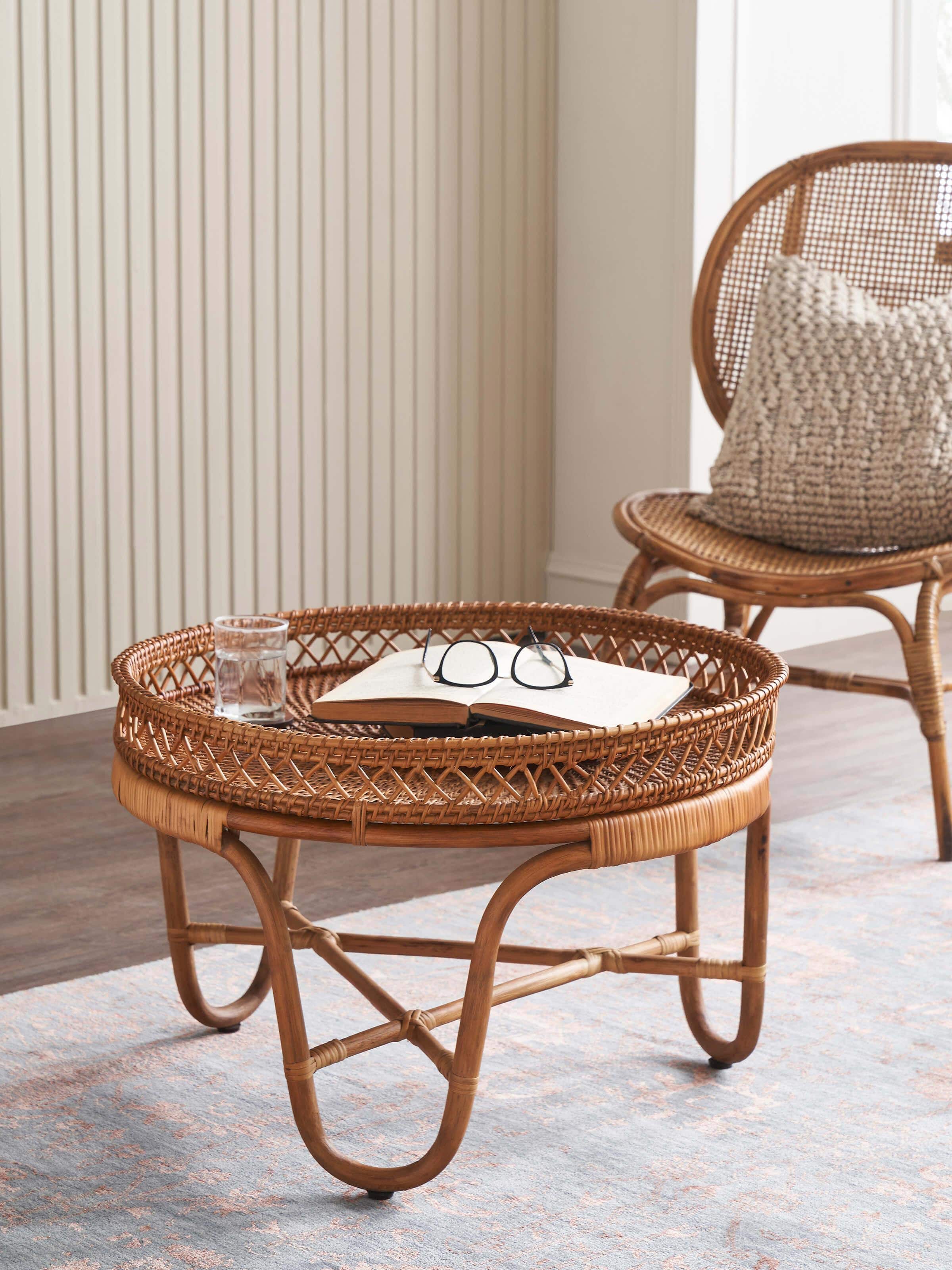 Side view of Cane Patio Table highlighting its round shape and cane weave details