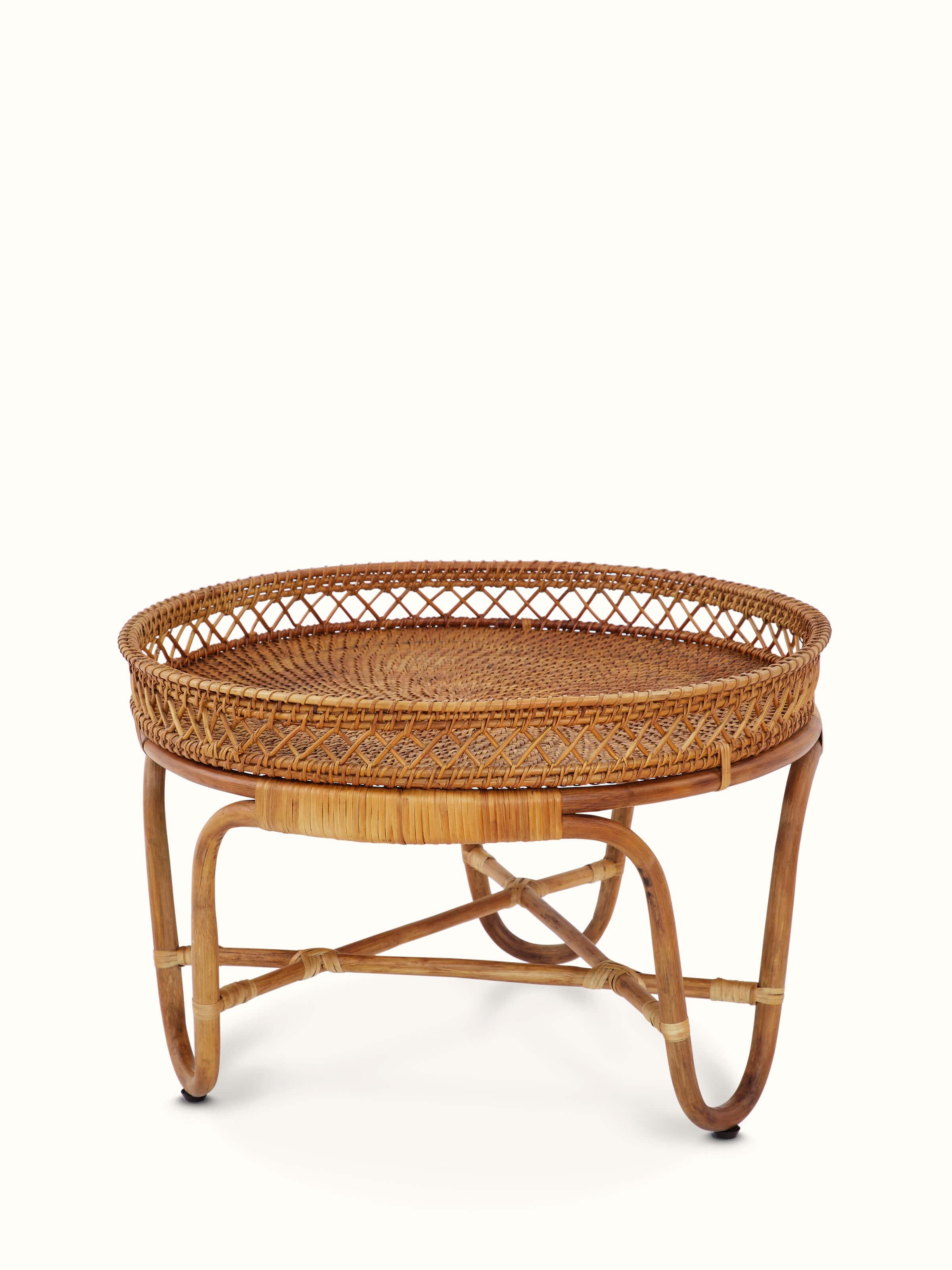 Angled view of Cane Patio Table emphasizing the table's sturdy construction and cane texture