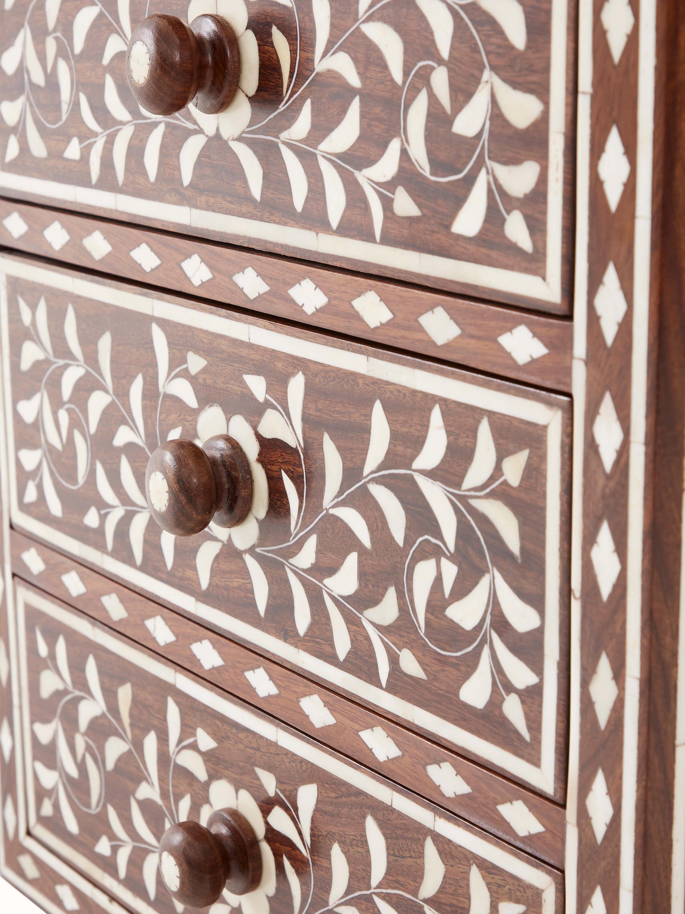 Close-up view of Sheesham wood bone inlay bedside table, showcasing detailed bone inlay patterns