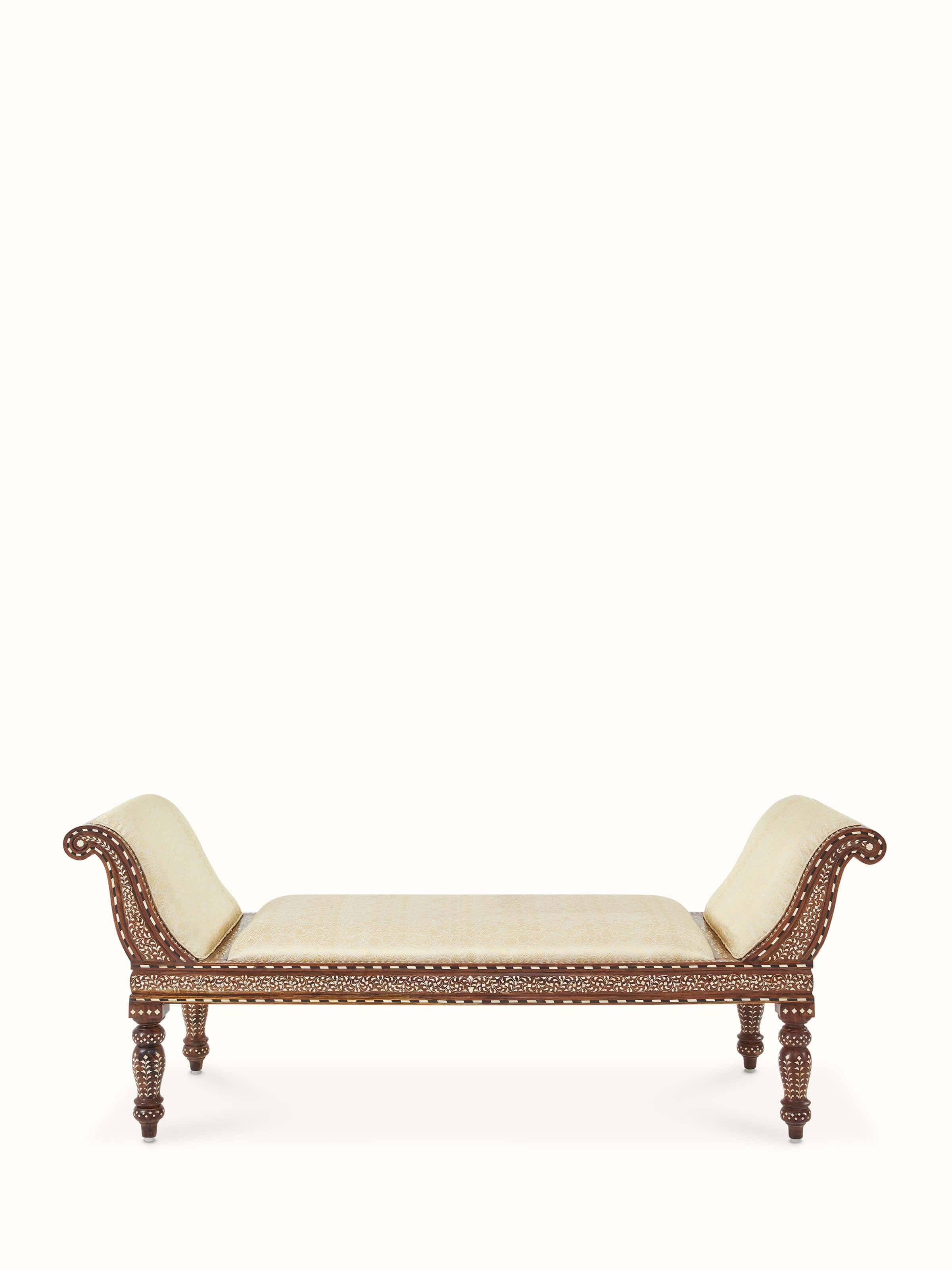 Side view of the upholstered Sheesham wood bench with intricate bone inlay detailing on the sides