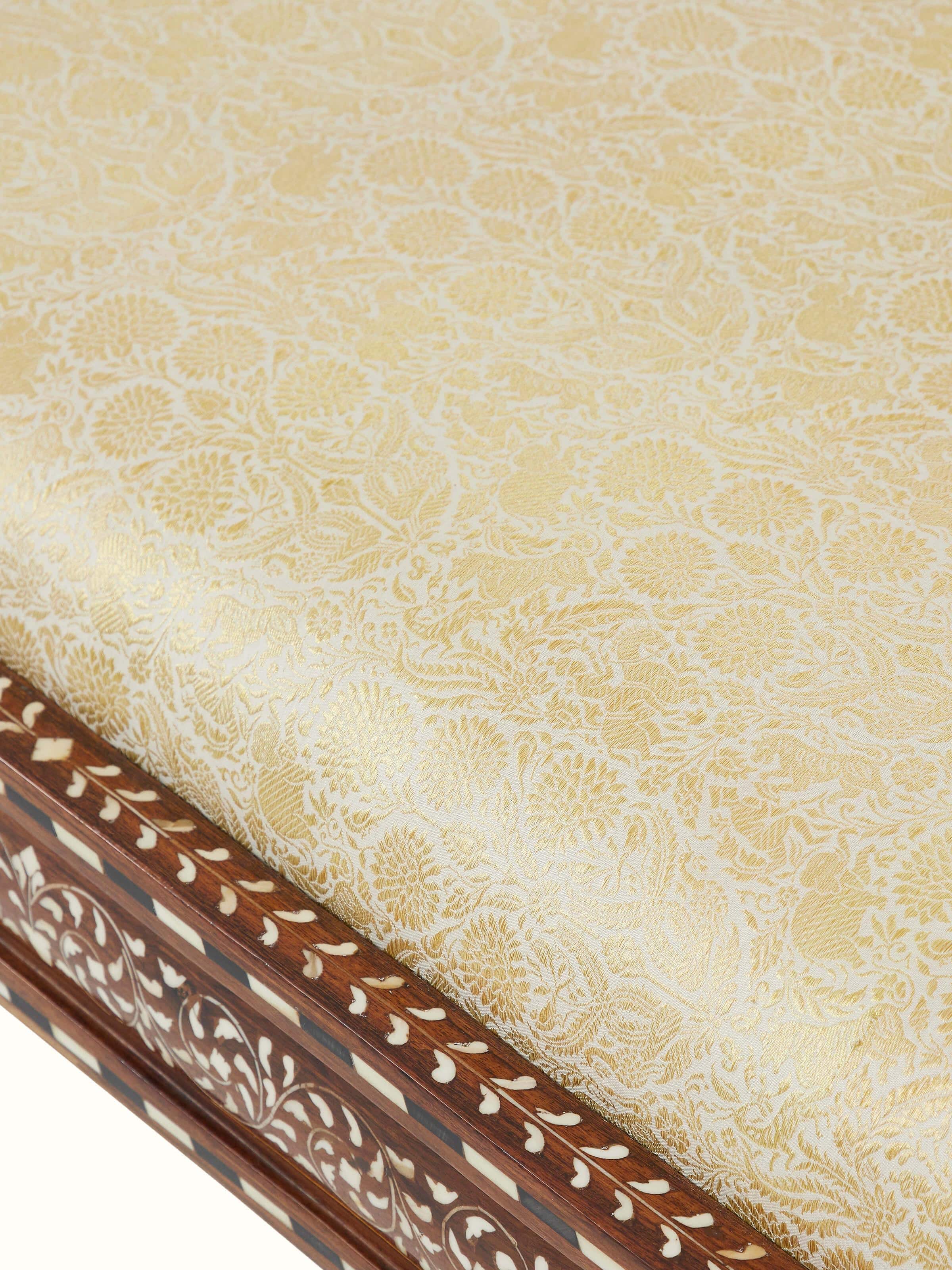 Top view of the upholstered Sheesham wood bench showing the fabric cushion and intricate bone inlay along the edges