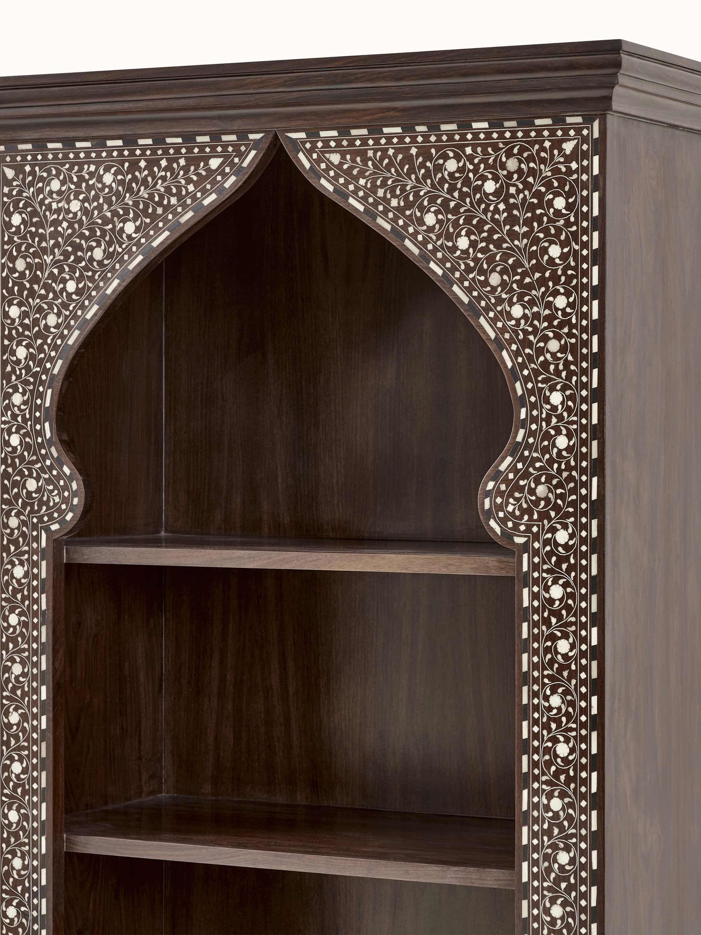Detailed view of the bookshelf's bone inlay work, emphasizing the intricate patterns.