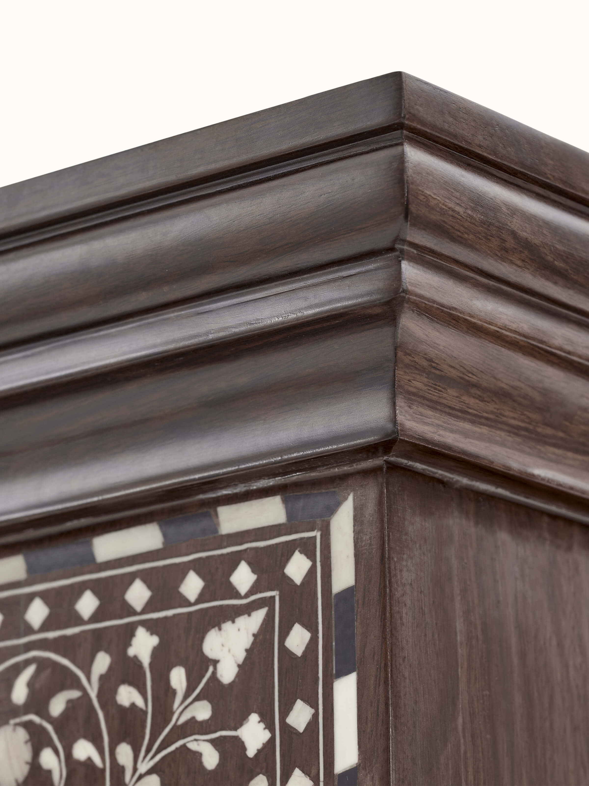 Close-up of the Sheesham wood bookshelf's side, showcasing the quality and details of the bone inlay.