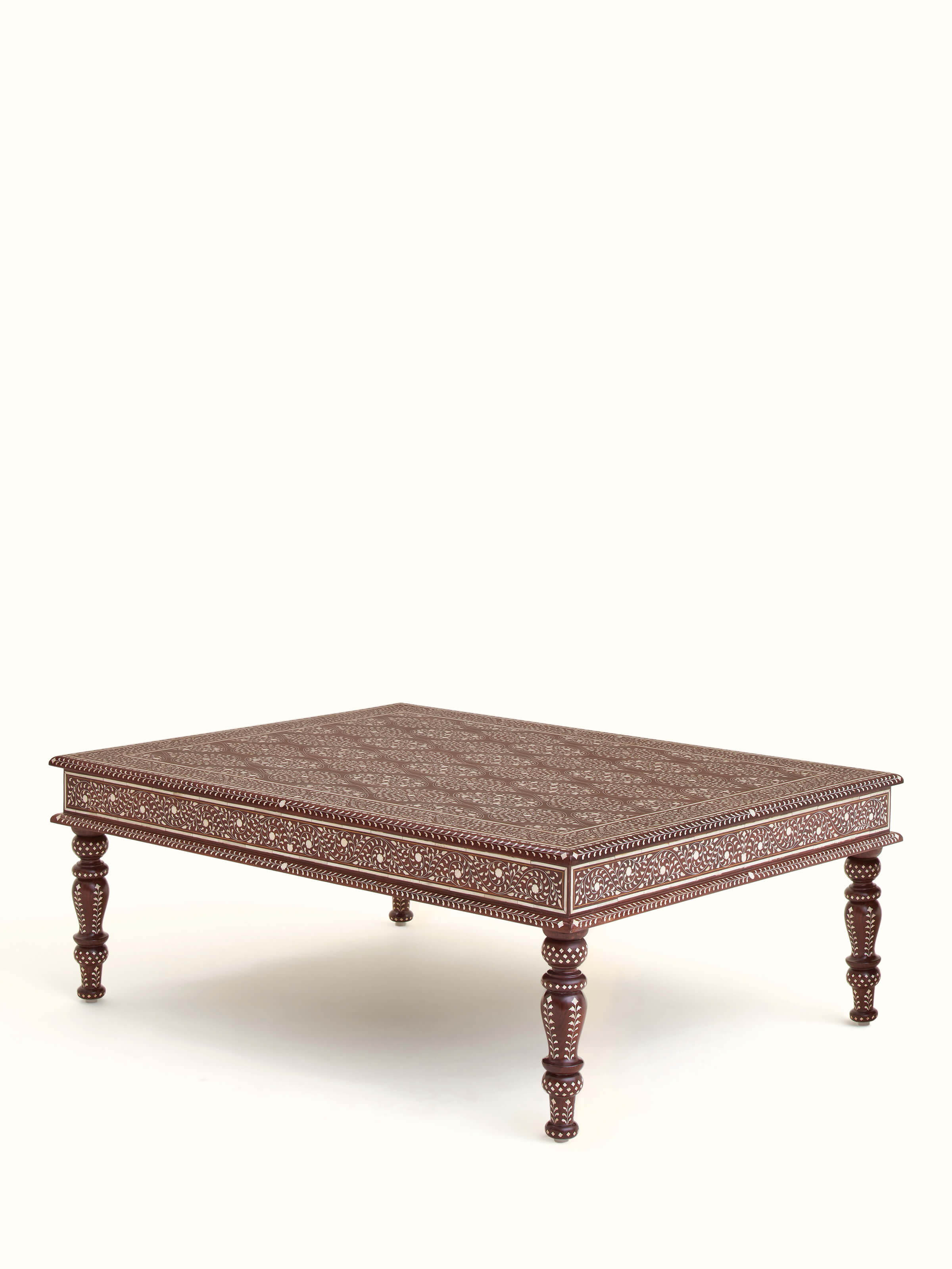 Angled view of Bone Inlay Sheesham Wood Coffee Table showing the stunning combination of bone inlay and natural wood texture.