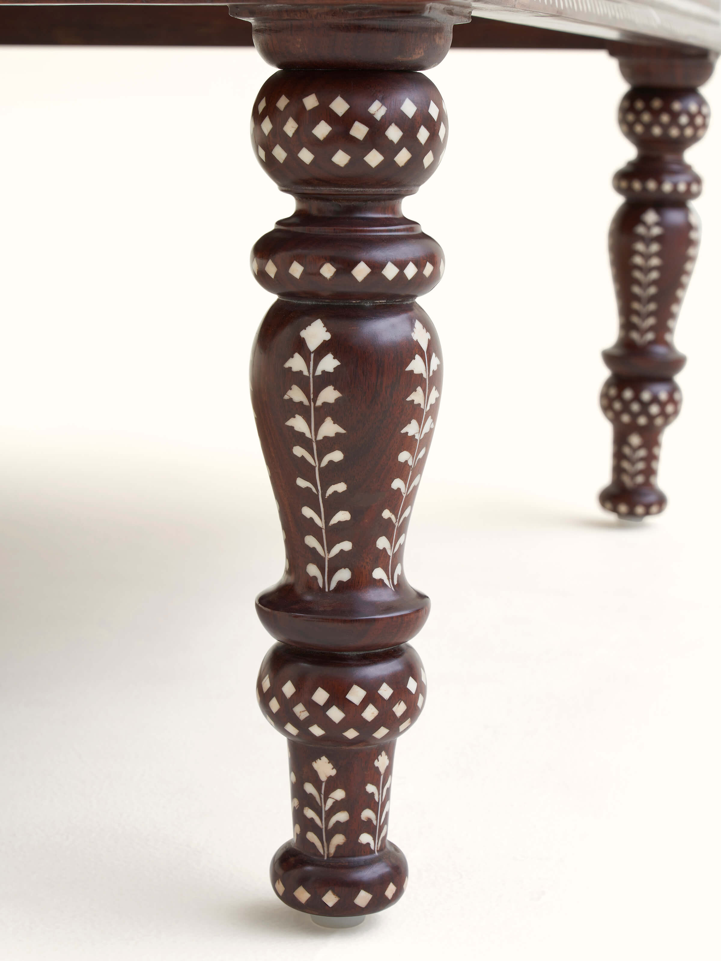 Detailed view of Bone Inlay Sheesham Wood Coffee Table displaying the fine bone inlay designs and smooth wood surface.