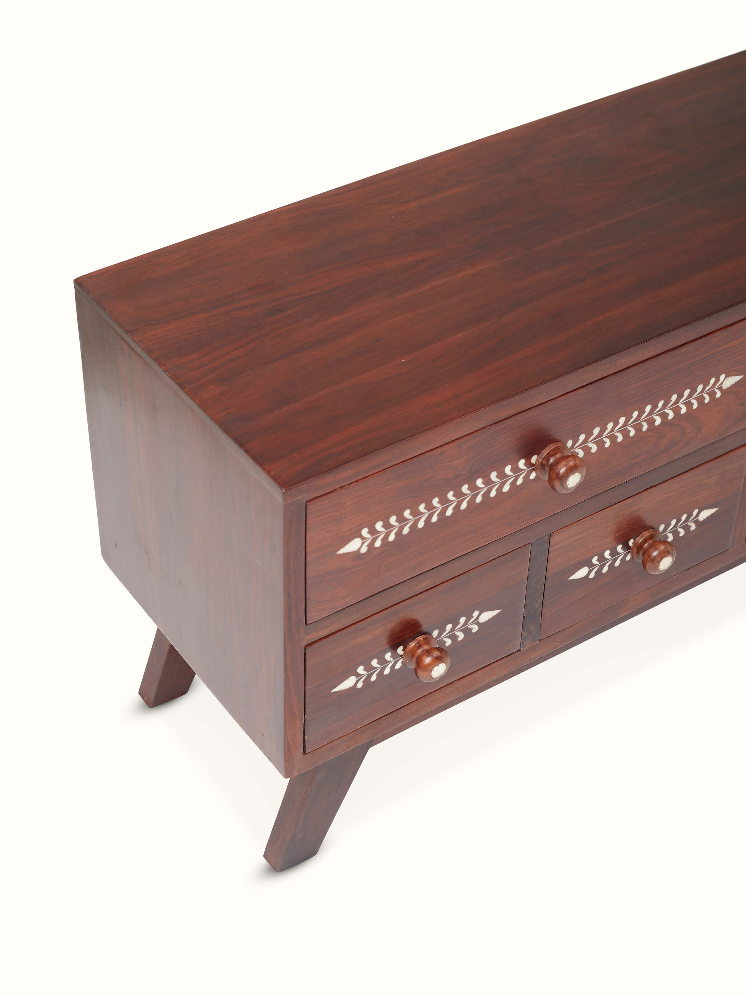 Close-up of the bone inlay design on the Sheesham wood entertainment unit, emphasizing the detailed craftsmanship.