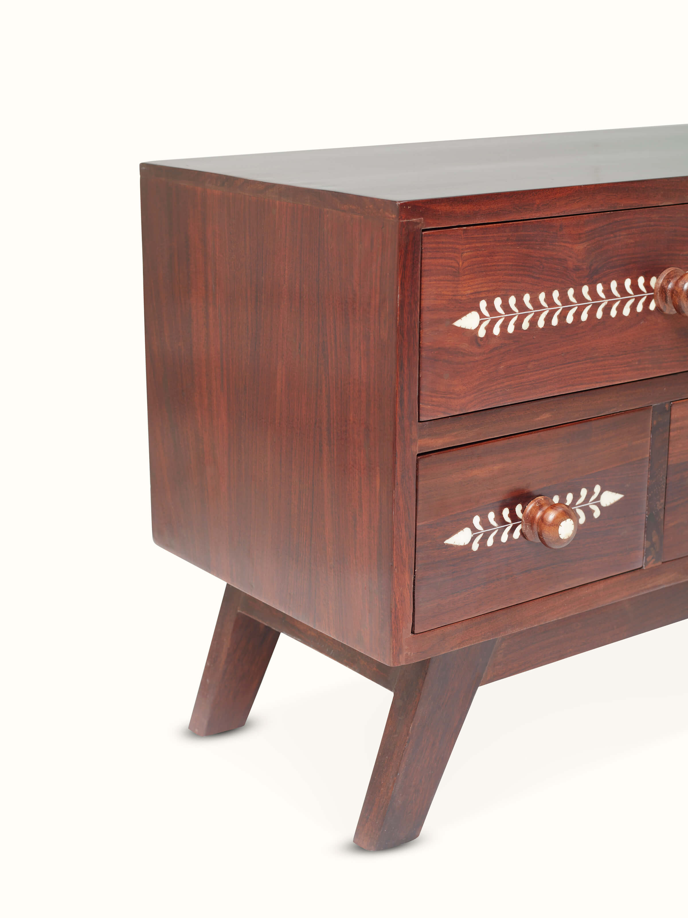 Angled view of the entertainment unit, focusing on the bone inlay work and the unit's overall design.