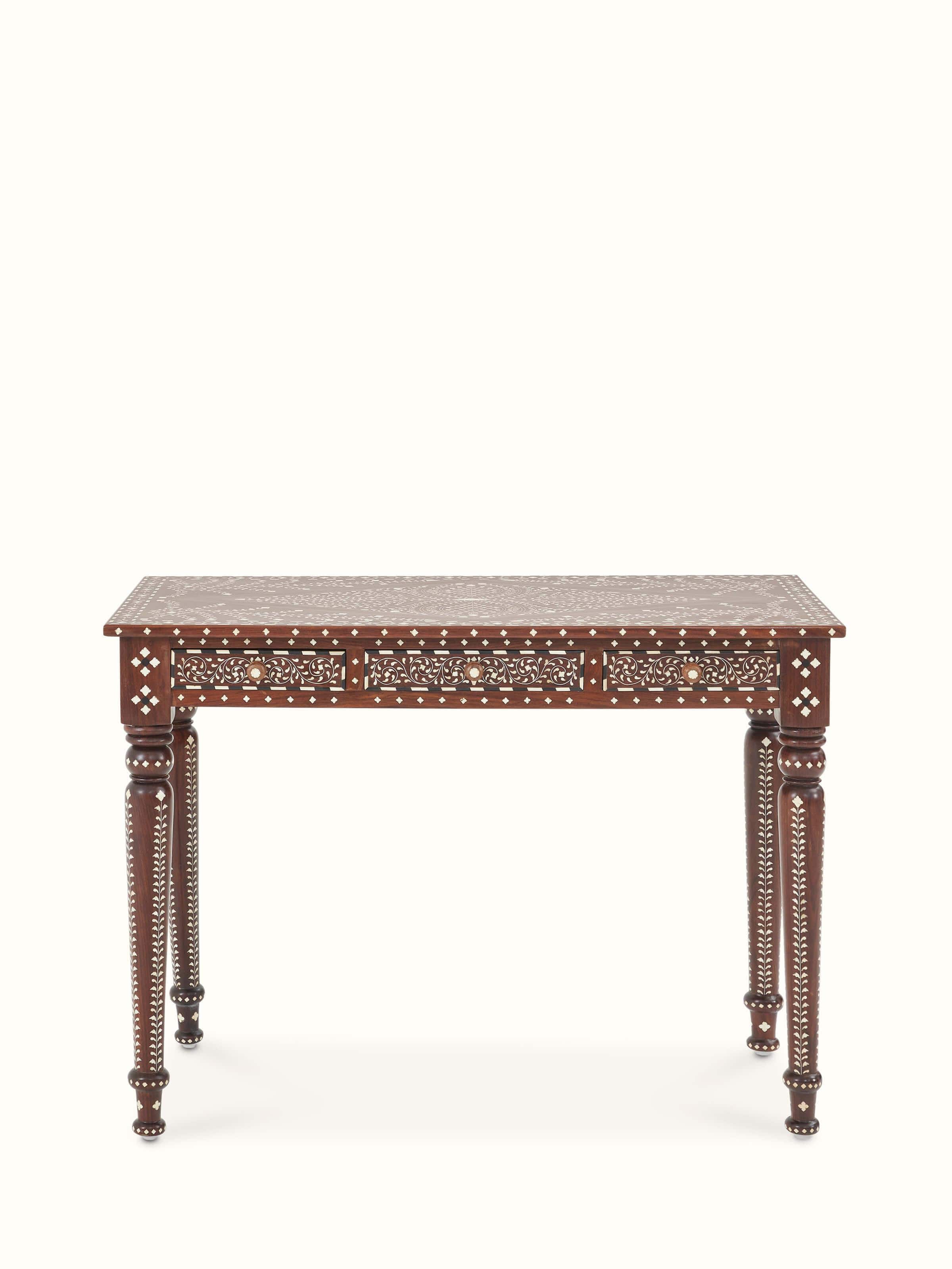 Front view of bone inlaid sheesham wood study table with 3 drawers, showcasing intricate inlay work and design.