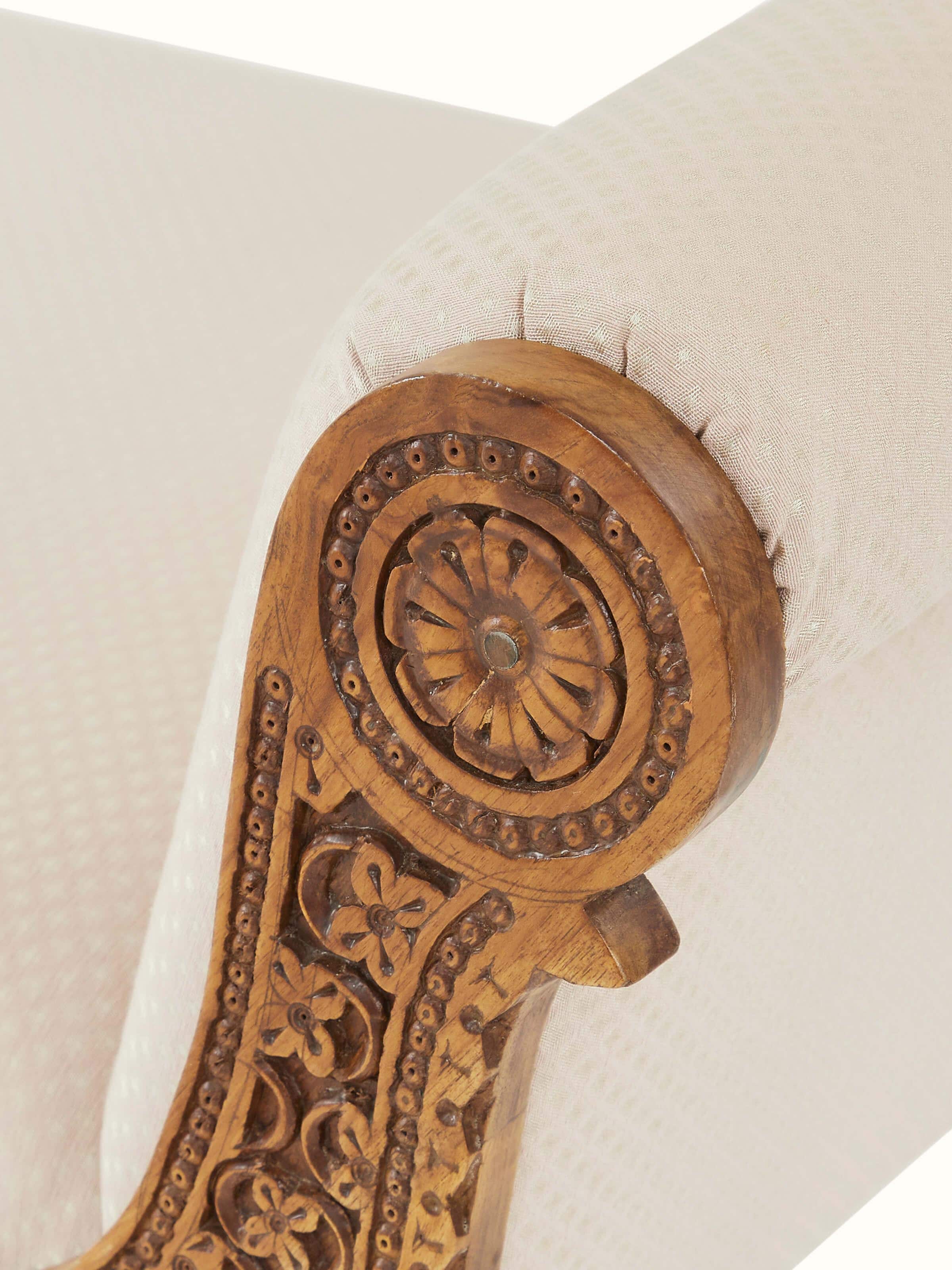 Detailed view of the bench’s legs and carvings, emphasizing the intricate design and durable construction