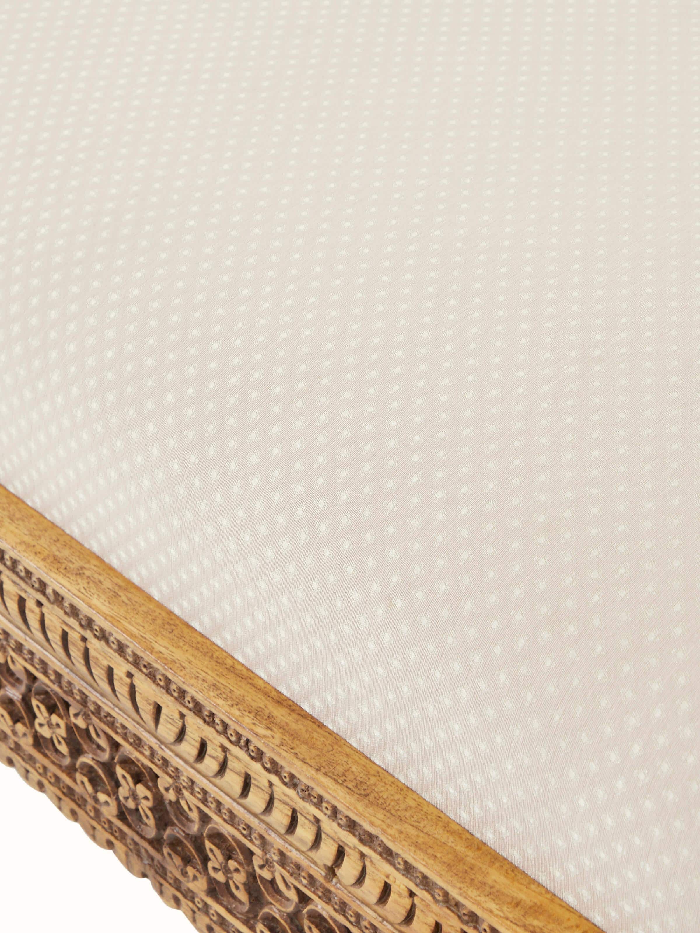 Top view of the carved Sheesham wood upholstered bench, highlighting the upholstery and detailed woodwork