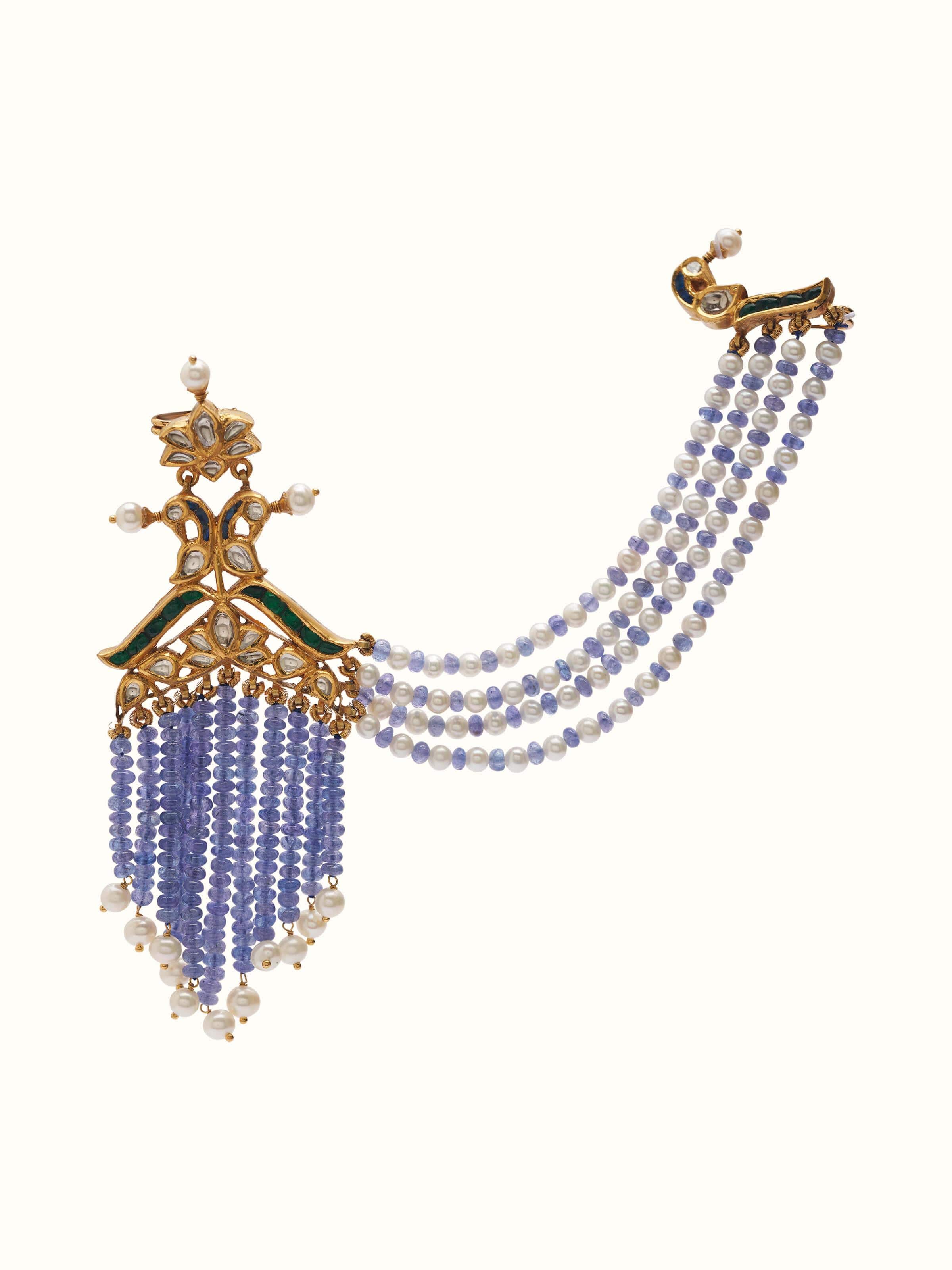 Front view of Jadau 18 Karat gold brooch pin adorned with colorful gemstones in a regal floral motif.