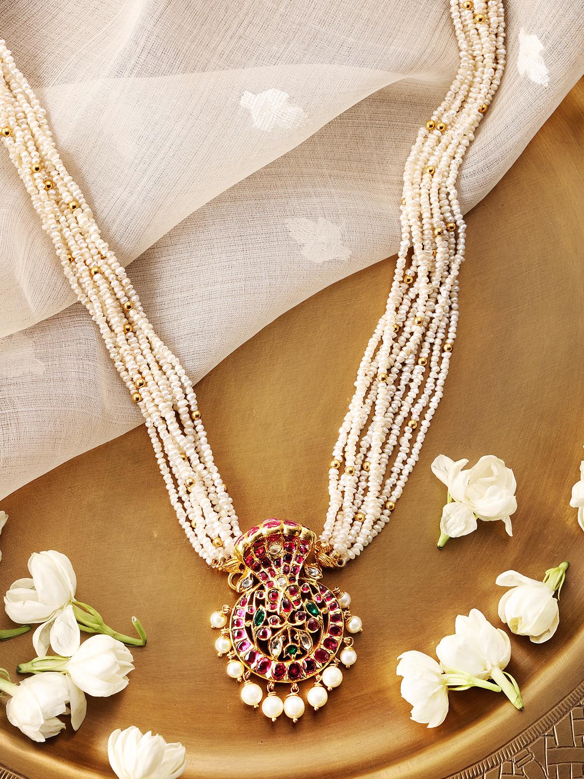 Kundala Velai 22 karat gold collar necklace displayed from a different angle to show its luxurious design.