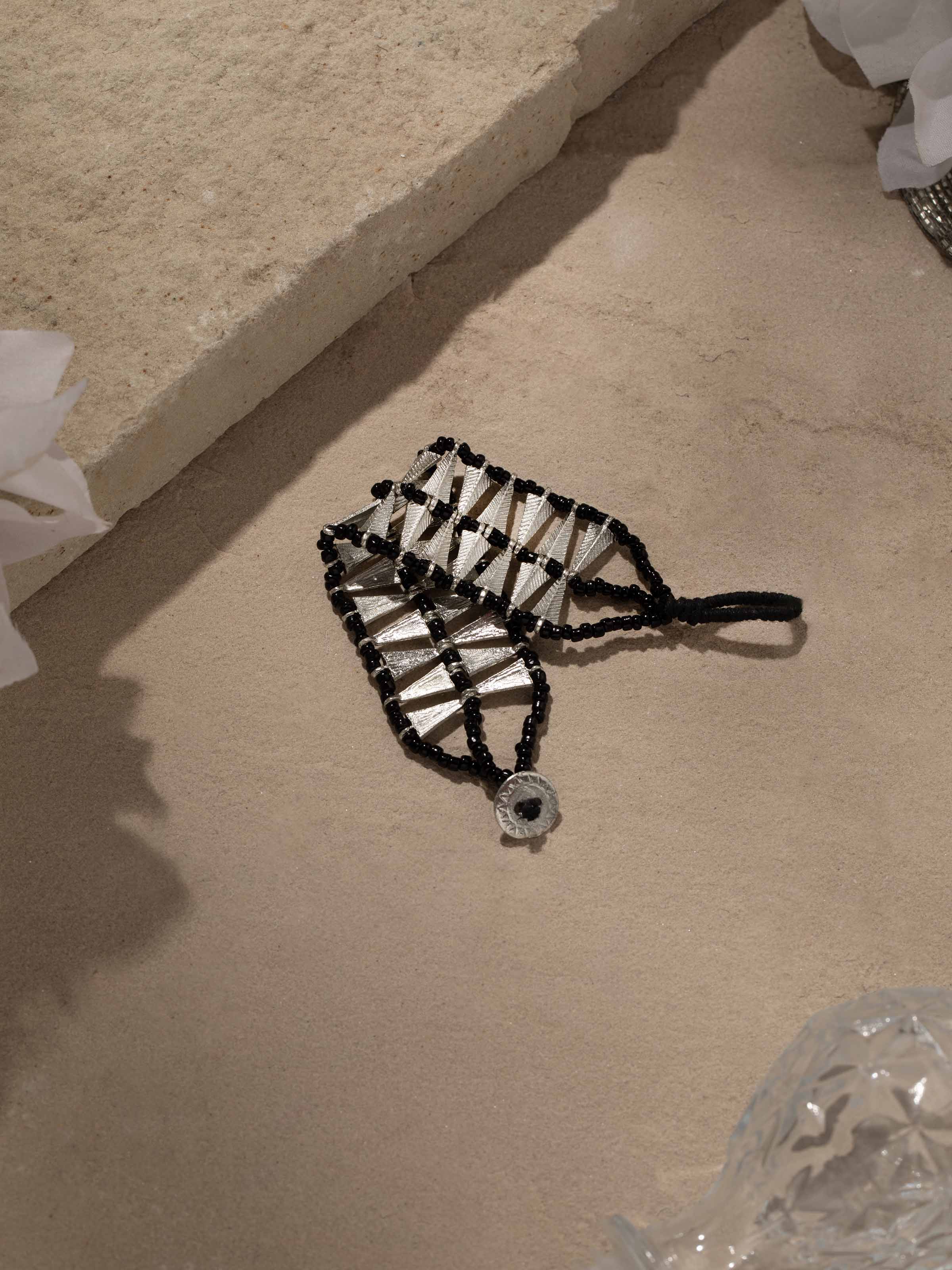 Side view of Handcrafted flexible bracelet showcasing its elegant design and flexible metalwork