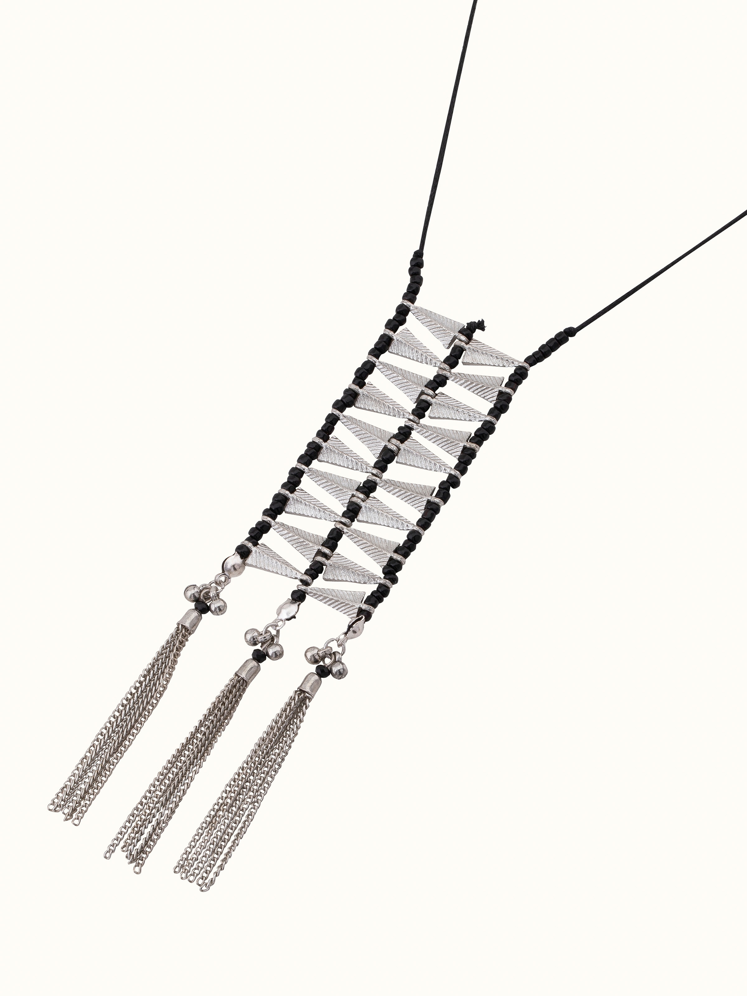 Detailed view of silver smithing drop earrings emphasizing fine details and quality craftsmanship.