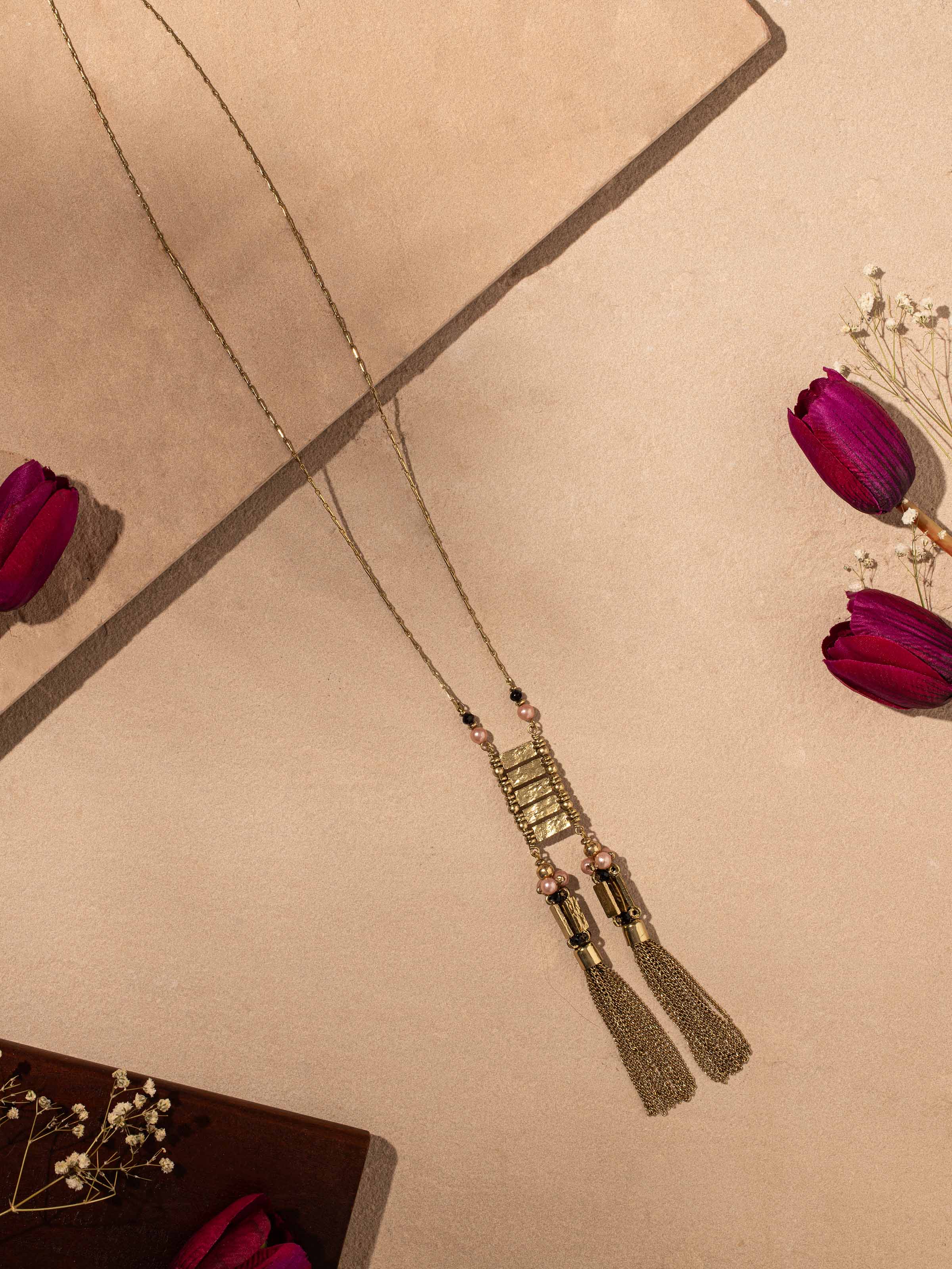 Side view of Handcrafted Long Necklace highlighting the elegant profile and unique design.