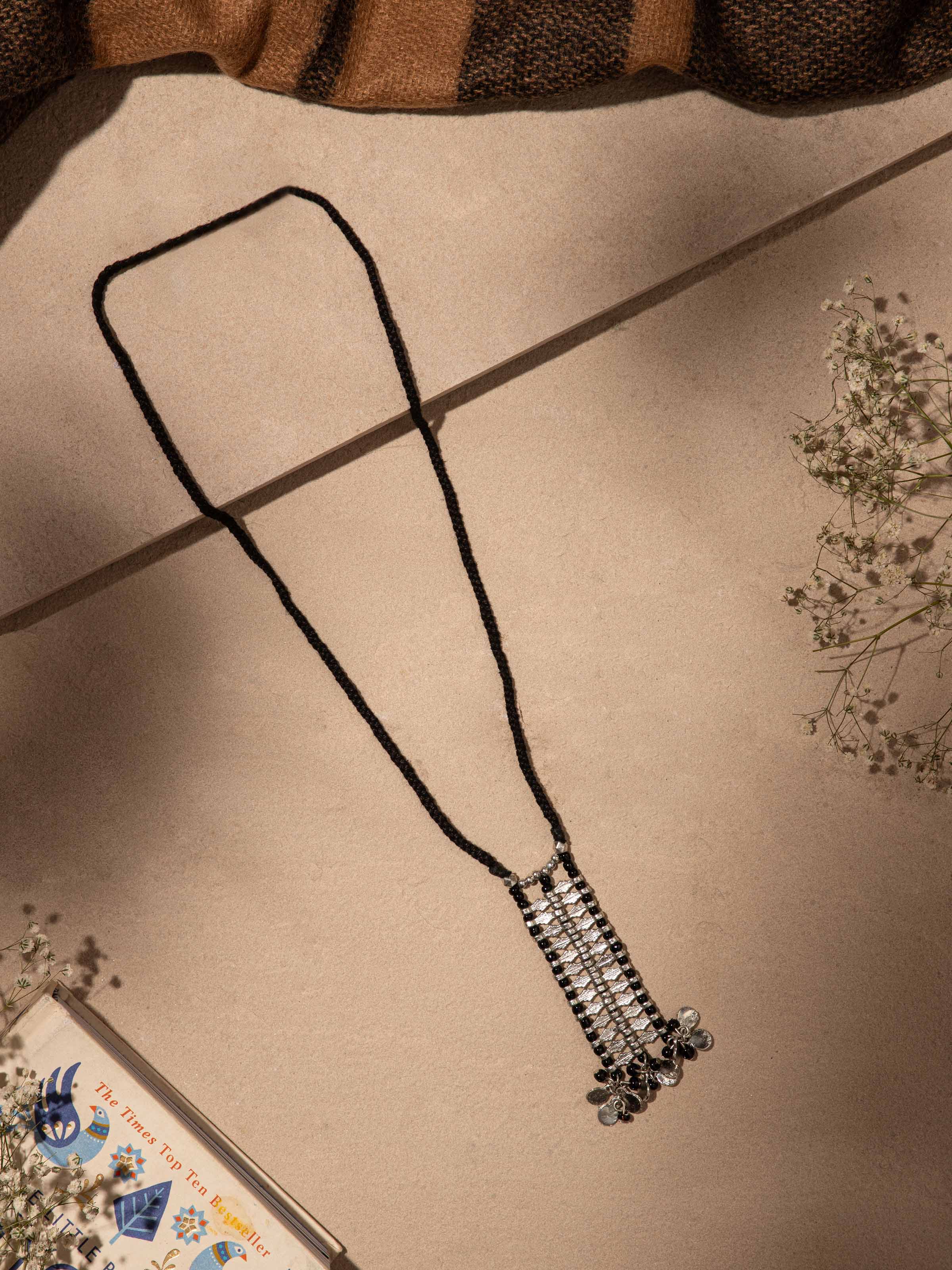 Close-up of Handcrafted Long Necklace highlighting the detailed work and elegant design.