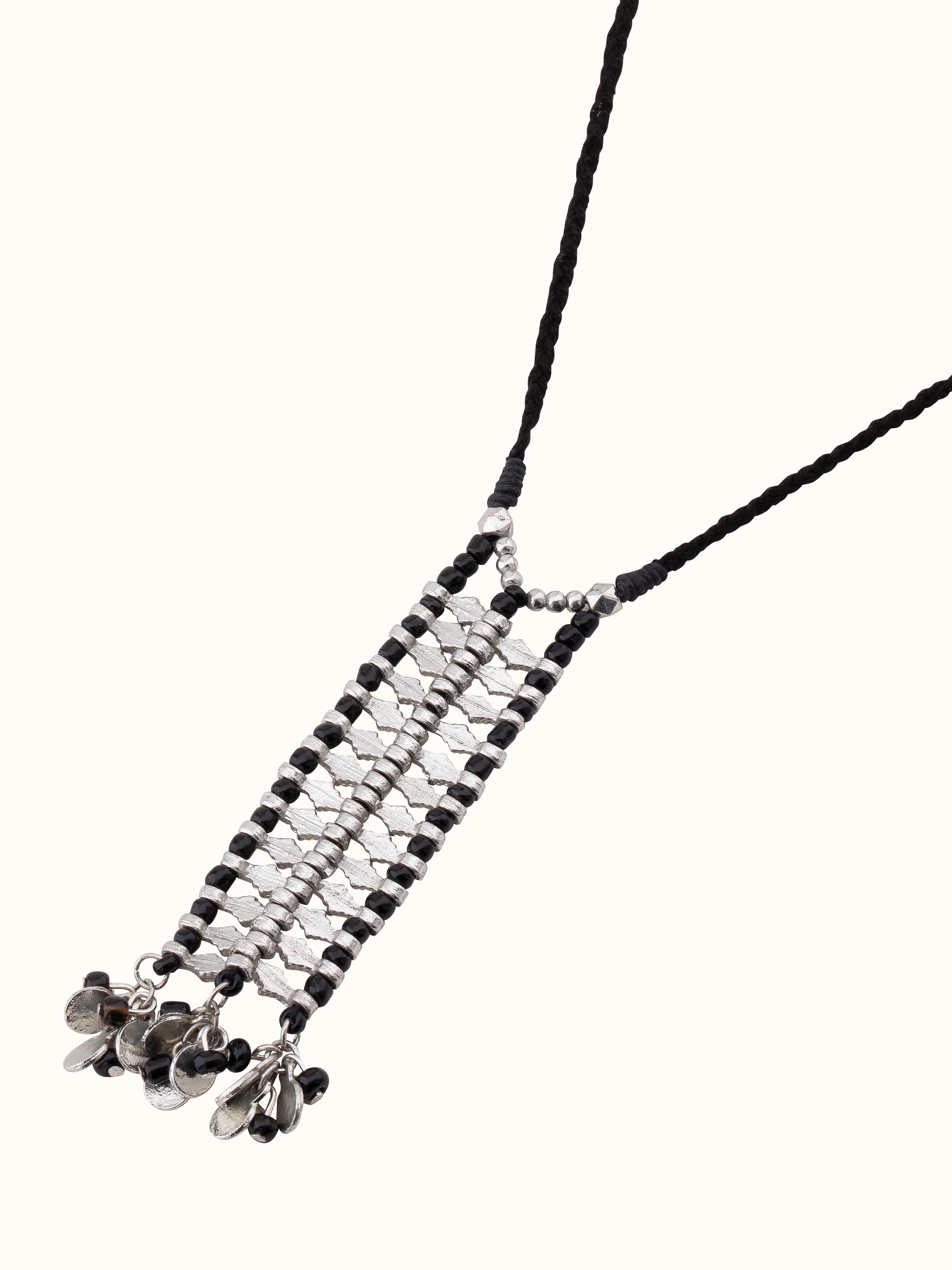 Overhead view of Handcrafted Long Necklace emphasizing its intricate patterns and craftsmanship.