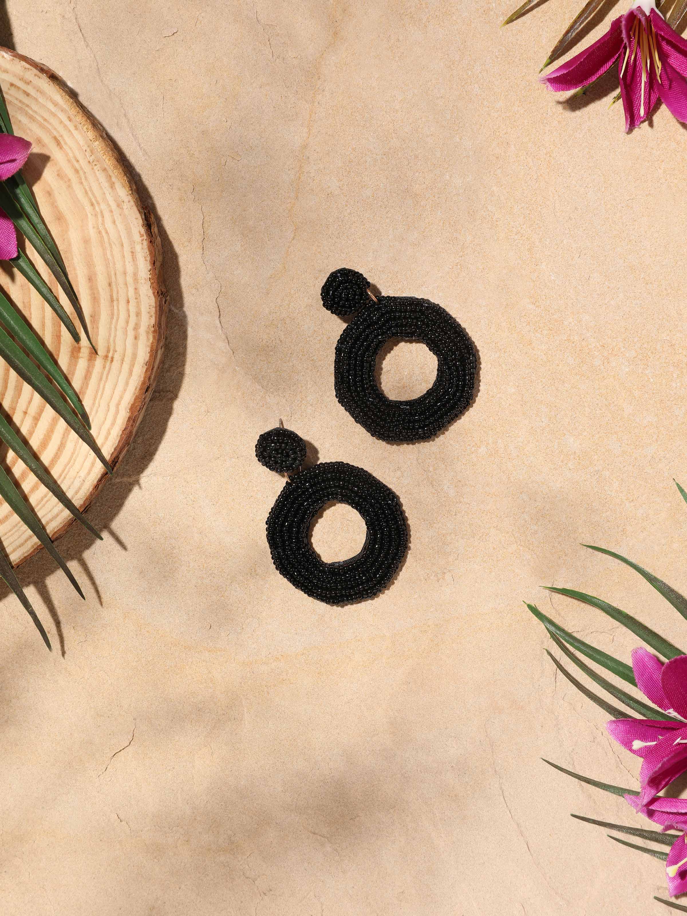 Close-up view of Handcrafted drop earrings focusing on their intricate details and fine craftsmanship