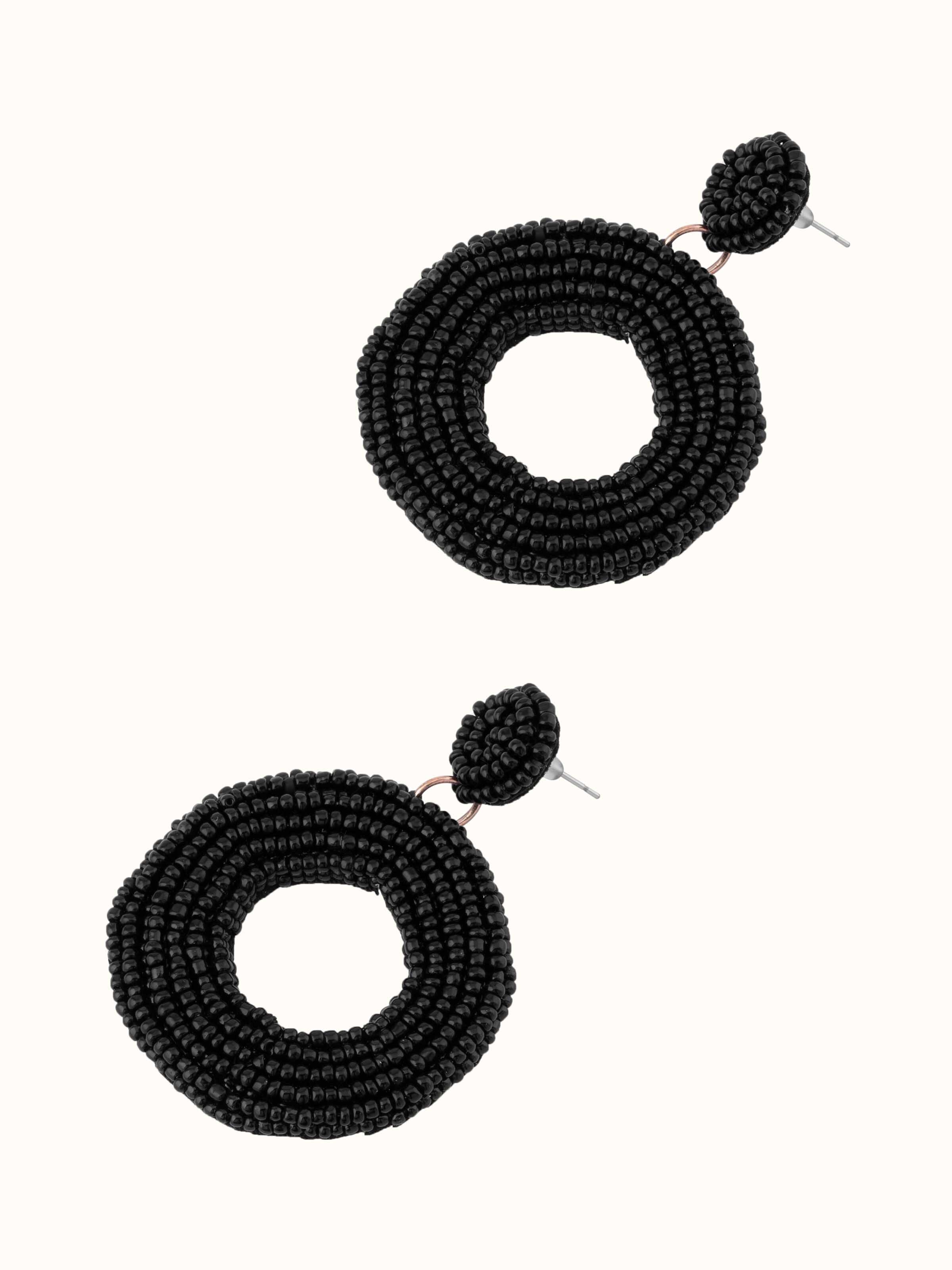 Angled view of Handcrafted drop earrings emphasizing their stylish drop and detailed work