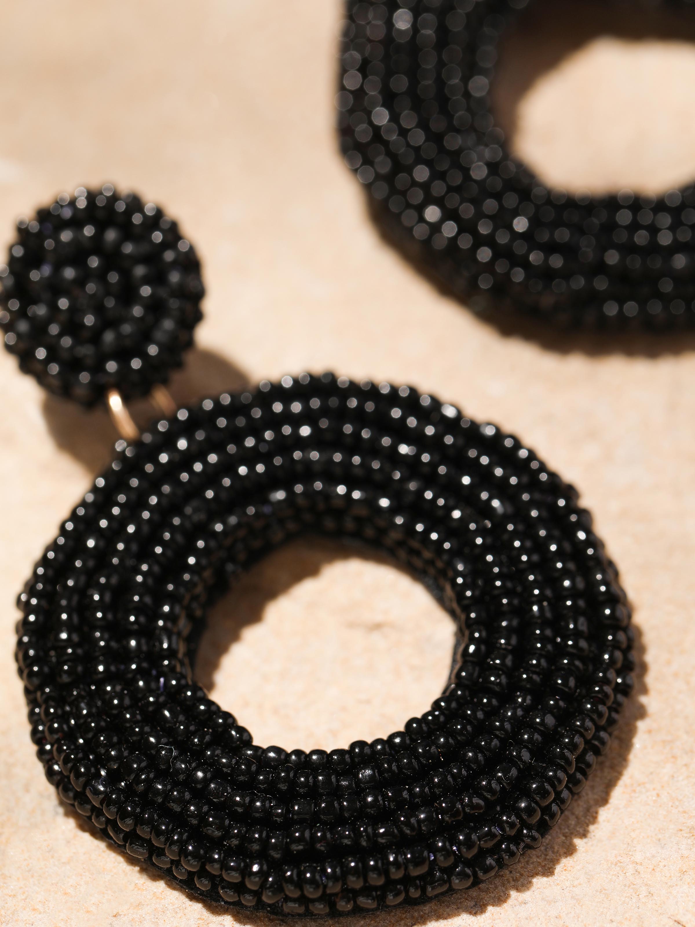 Detailed front view of Handcrafted drop earrings showcasing their elegant design and artisanal quality