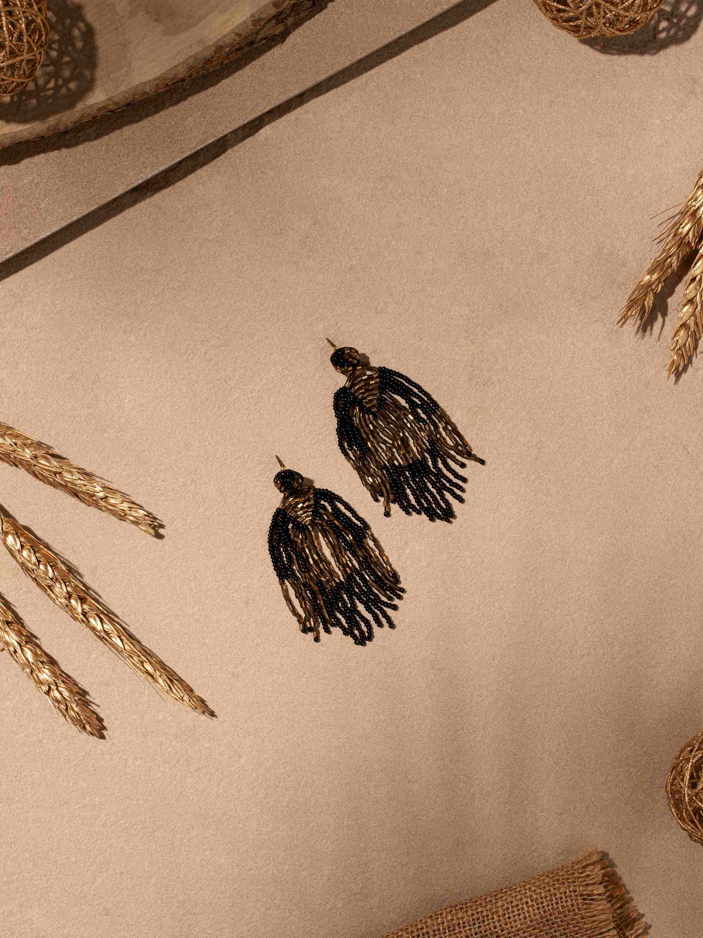 Side view of Silver Smithing Drop Earrings showcasing their intricate detailing.