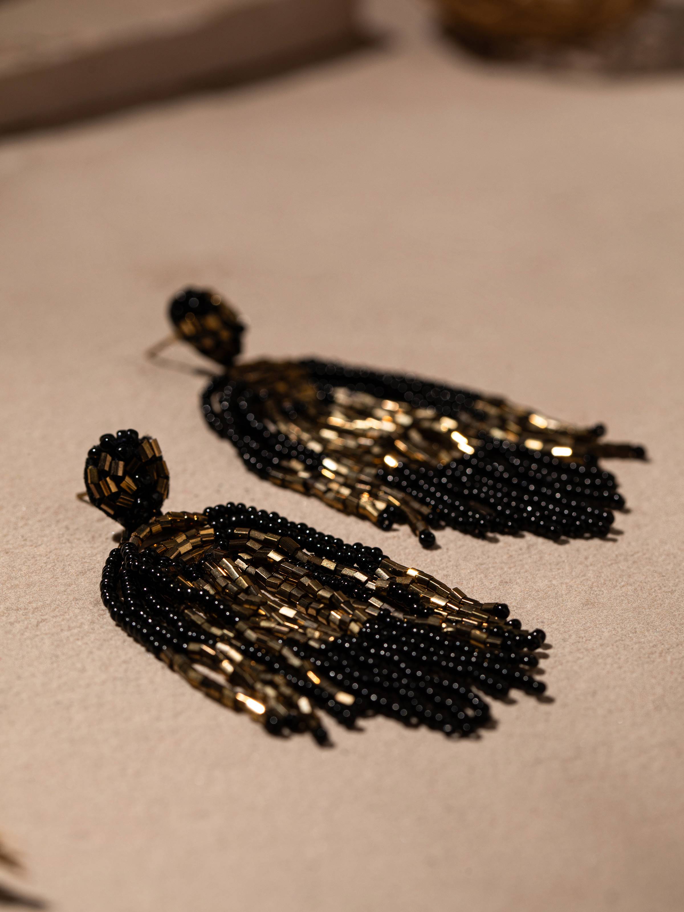 Silver Smithing Drop Earrings in natural light showcasing their polished design.