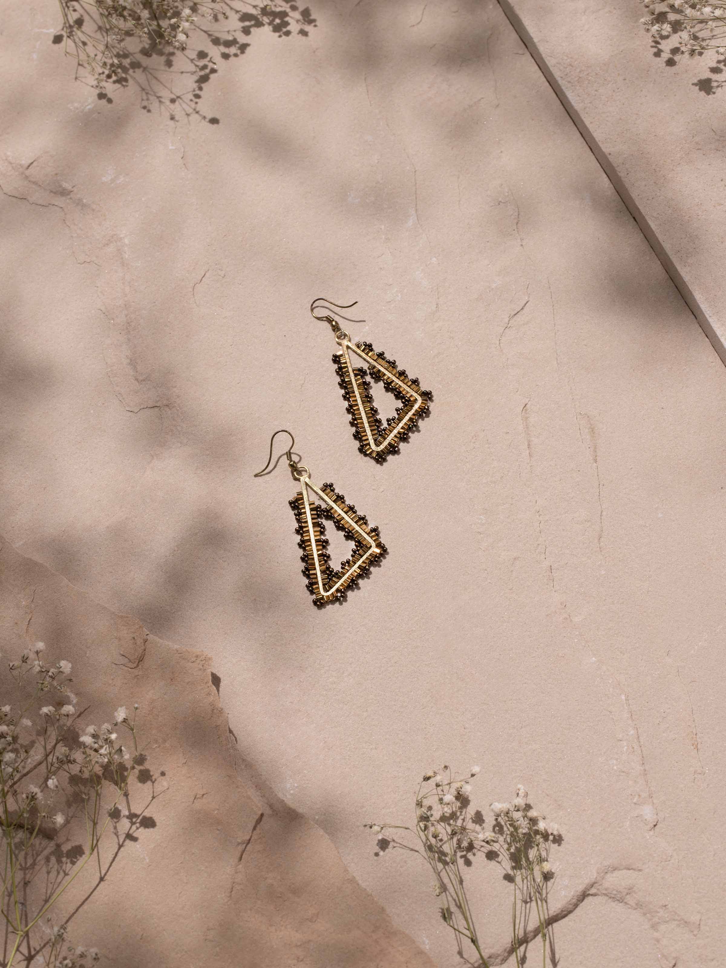 Side view of Handcrafted drop earrings highlighting their elegant drop and intricate details.
