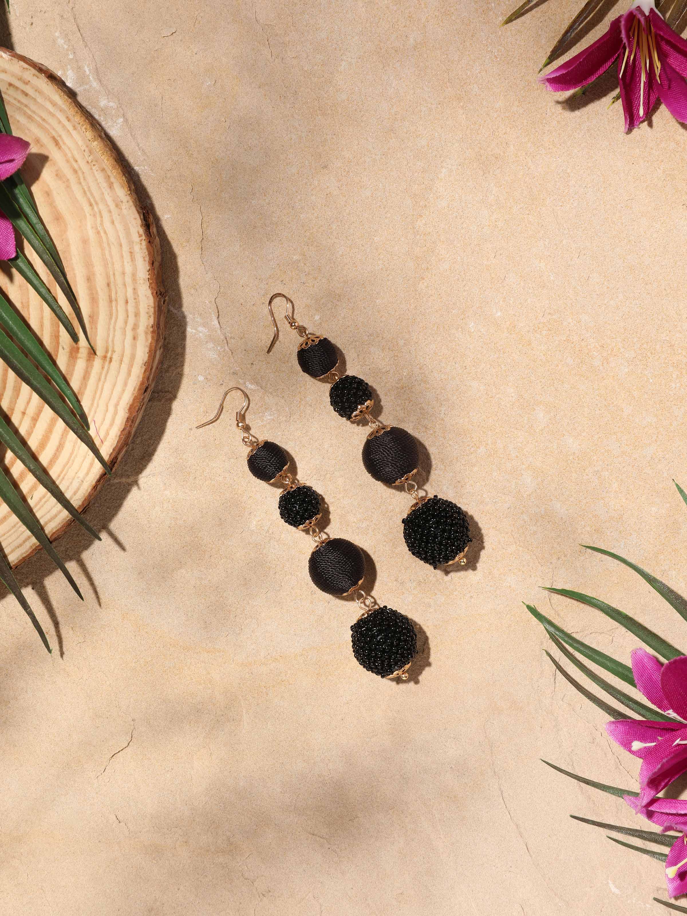 Side view of Handcrafted Drop Earrings showcasing their elegant drop design.