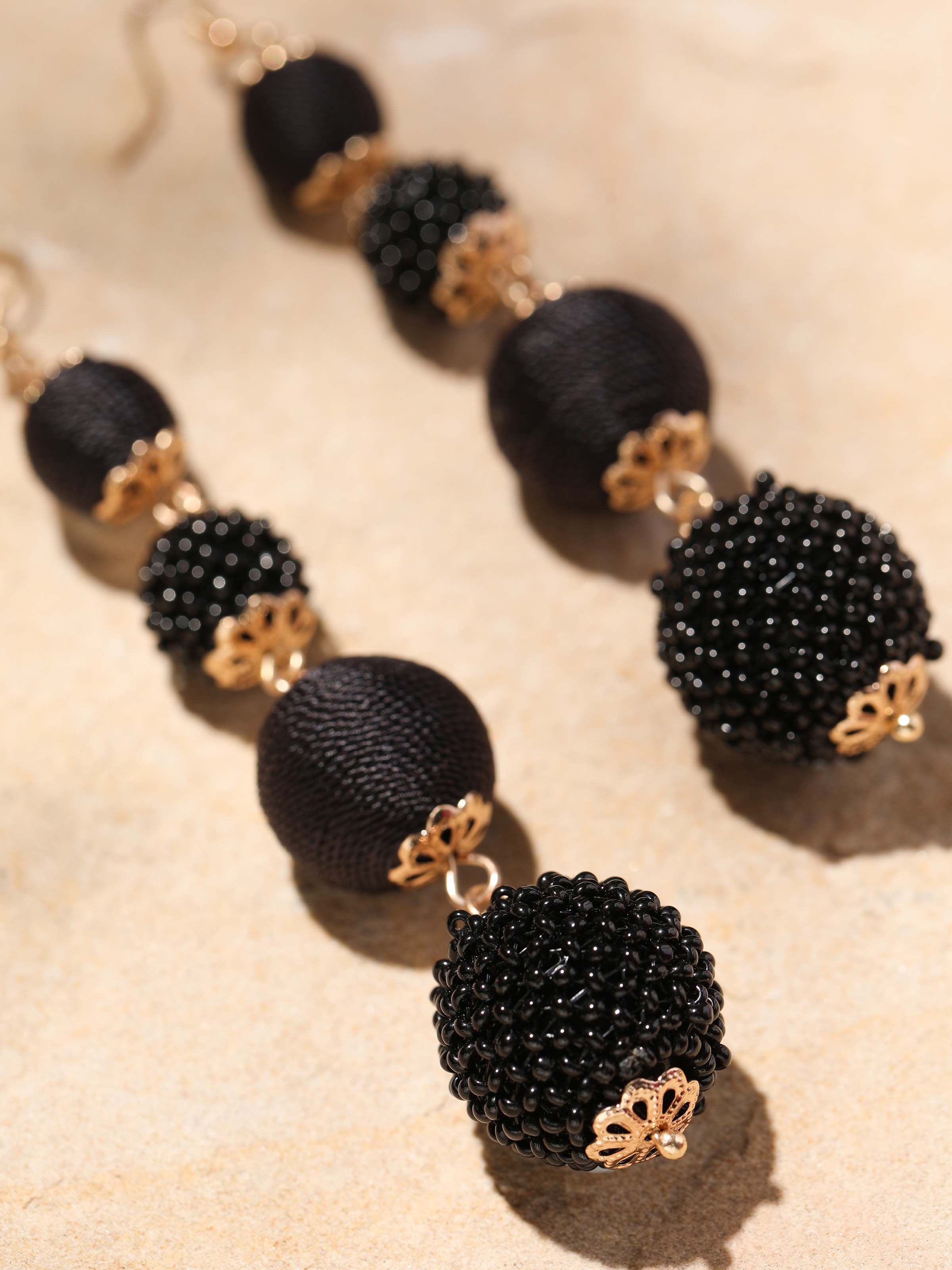 Detailed view of Handcrafted Drop Earrings focusing on the intricate details and high-quality craftsmanship.
