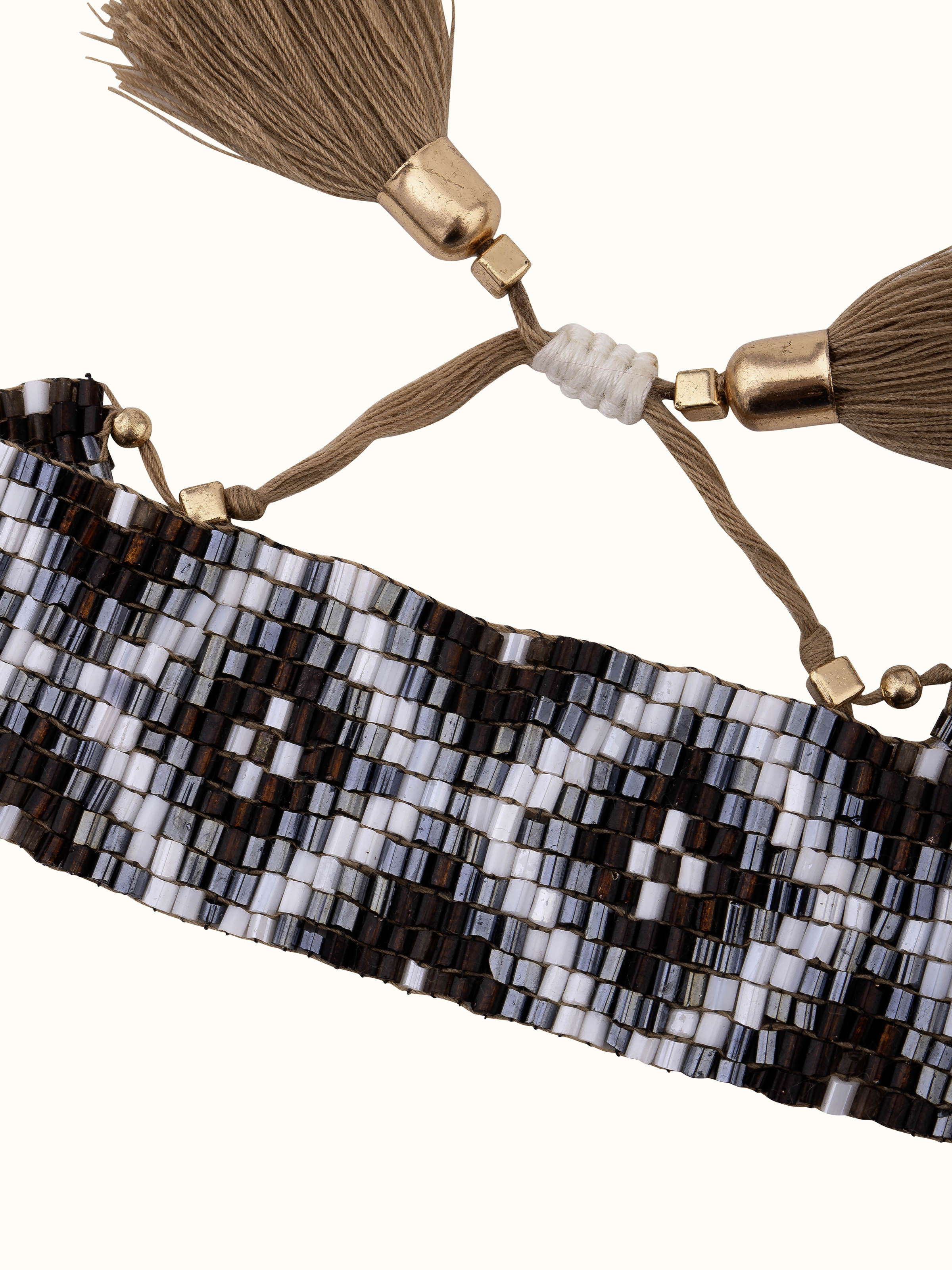 Angled view of Handcrafted Flexible Bracelet displaying stylish curves and details.