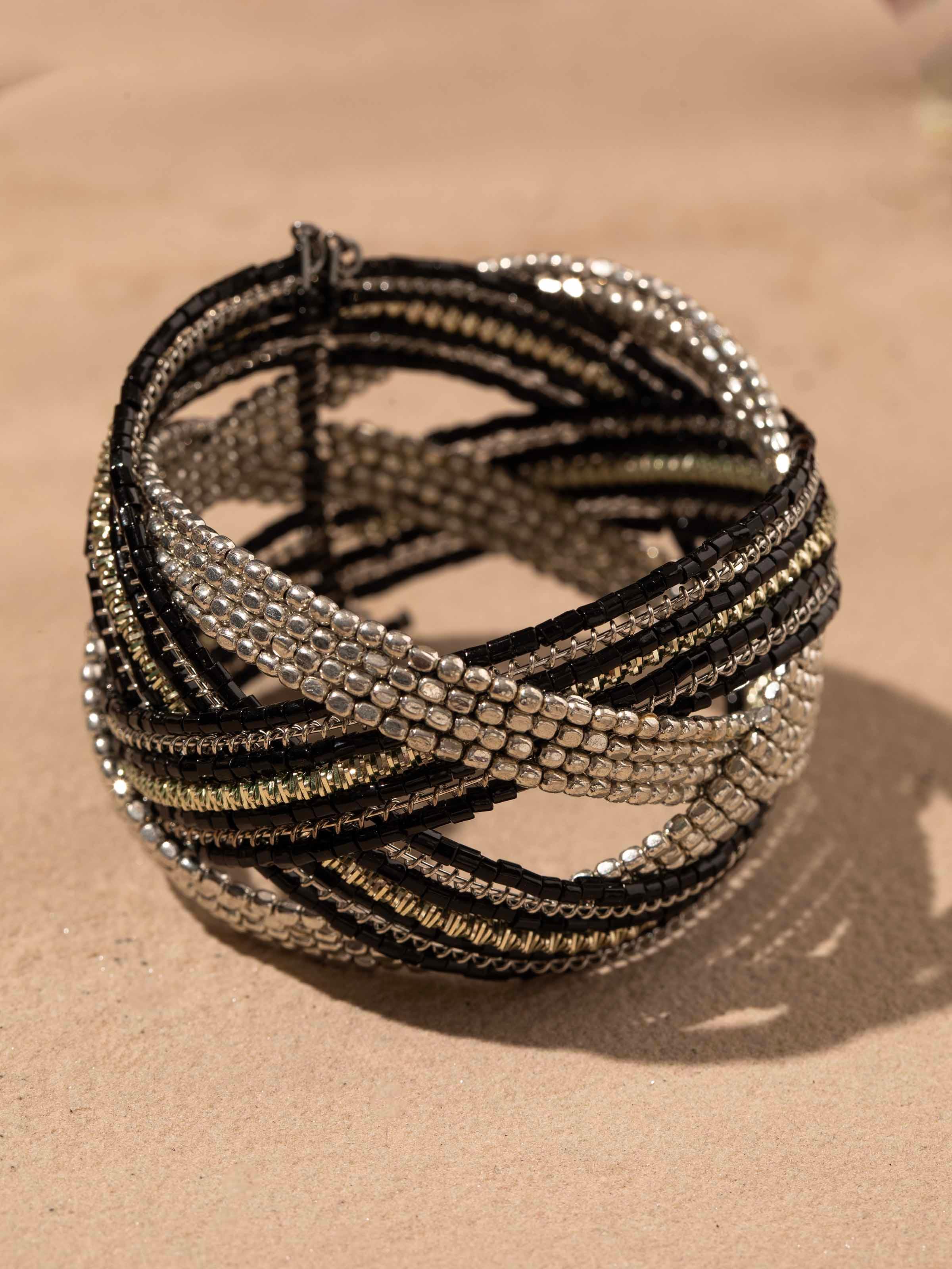 Back view of handcrafted flexible bracelet showing the clasp and overall design.