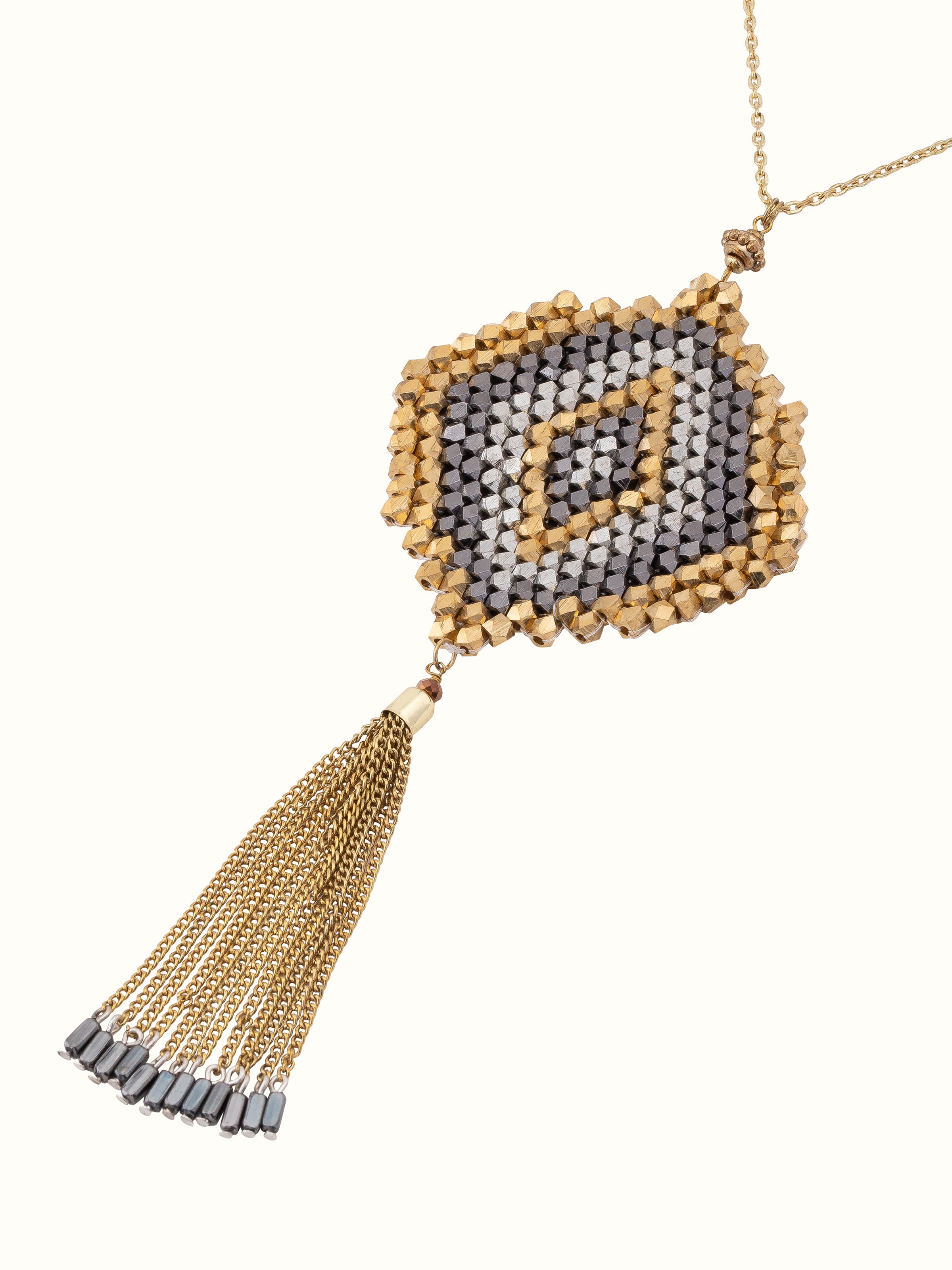 Angled view of handcrafted long necklace showcasing its intricate design and artistic detailing