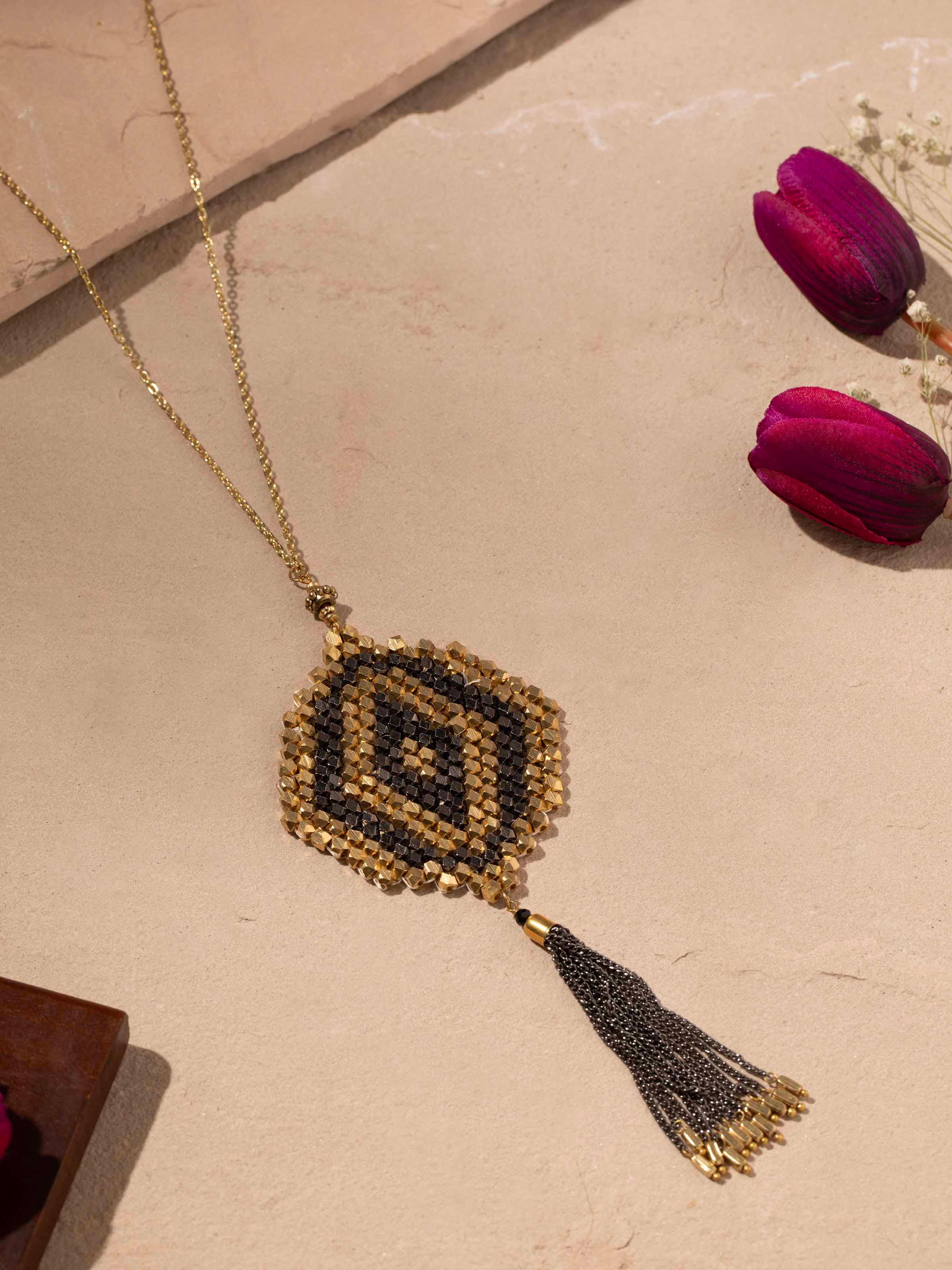Close-up view of handcrafted long necklace focusing on its intricate details and beadwork