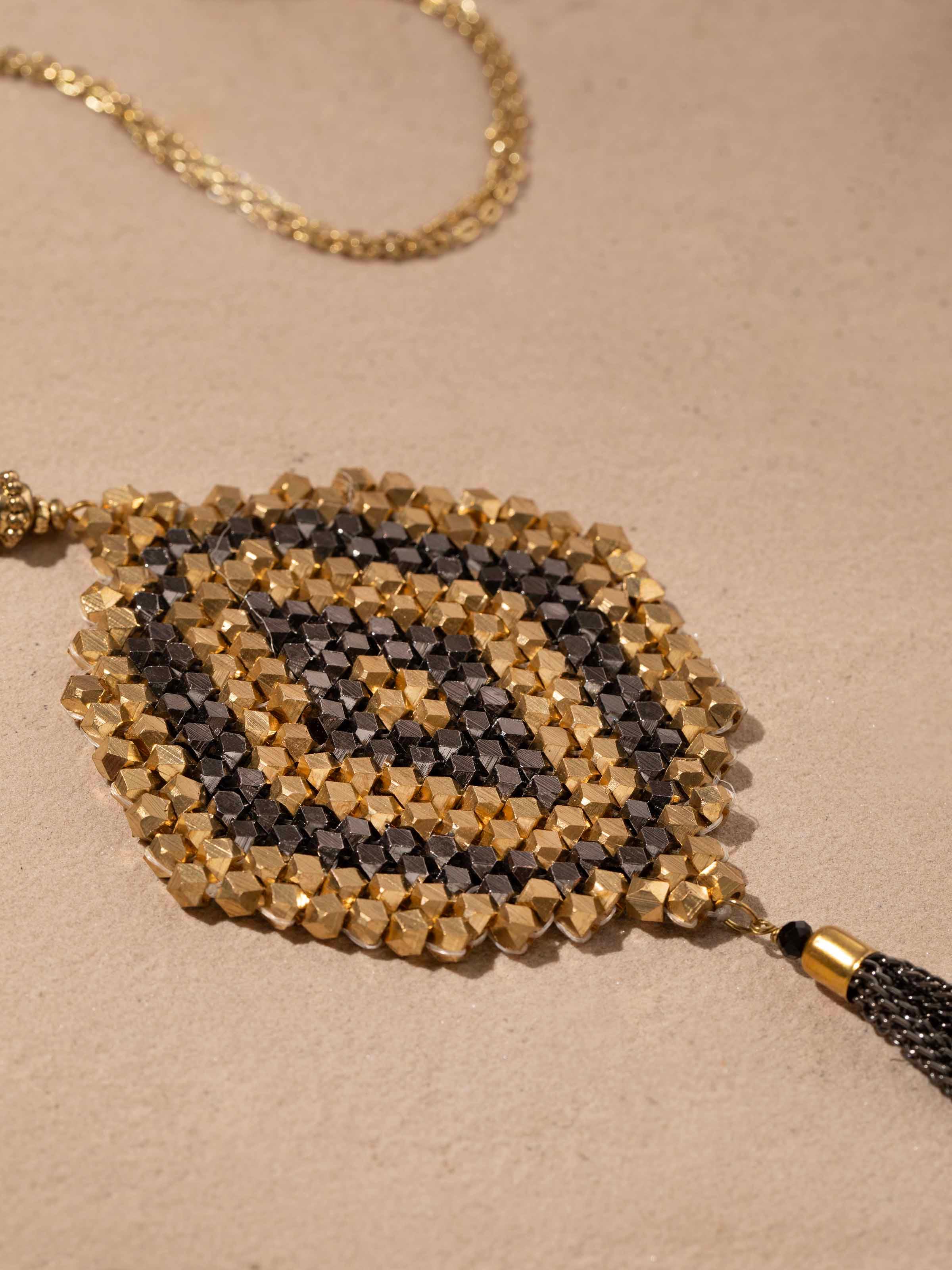 Detailed front view of handcrafted long necklace emphasizing its artistic bead arrangement