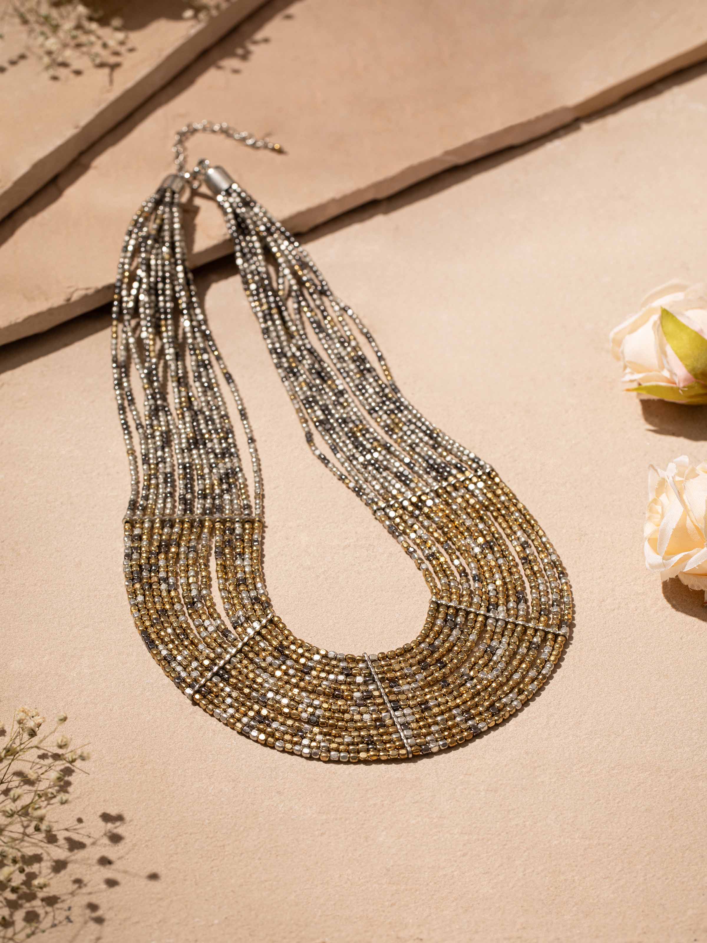 Side view of handcrafted long necklace showcasing detailed beadwork and elegant design