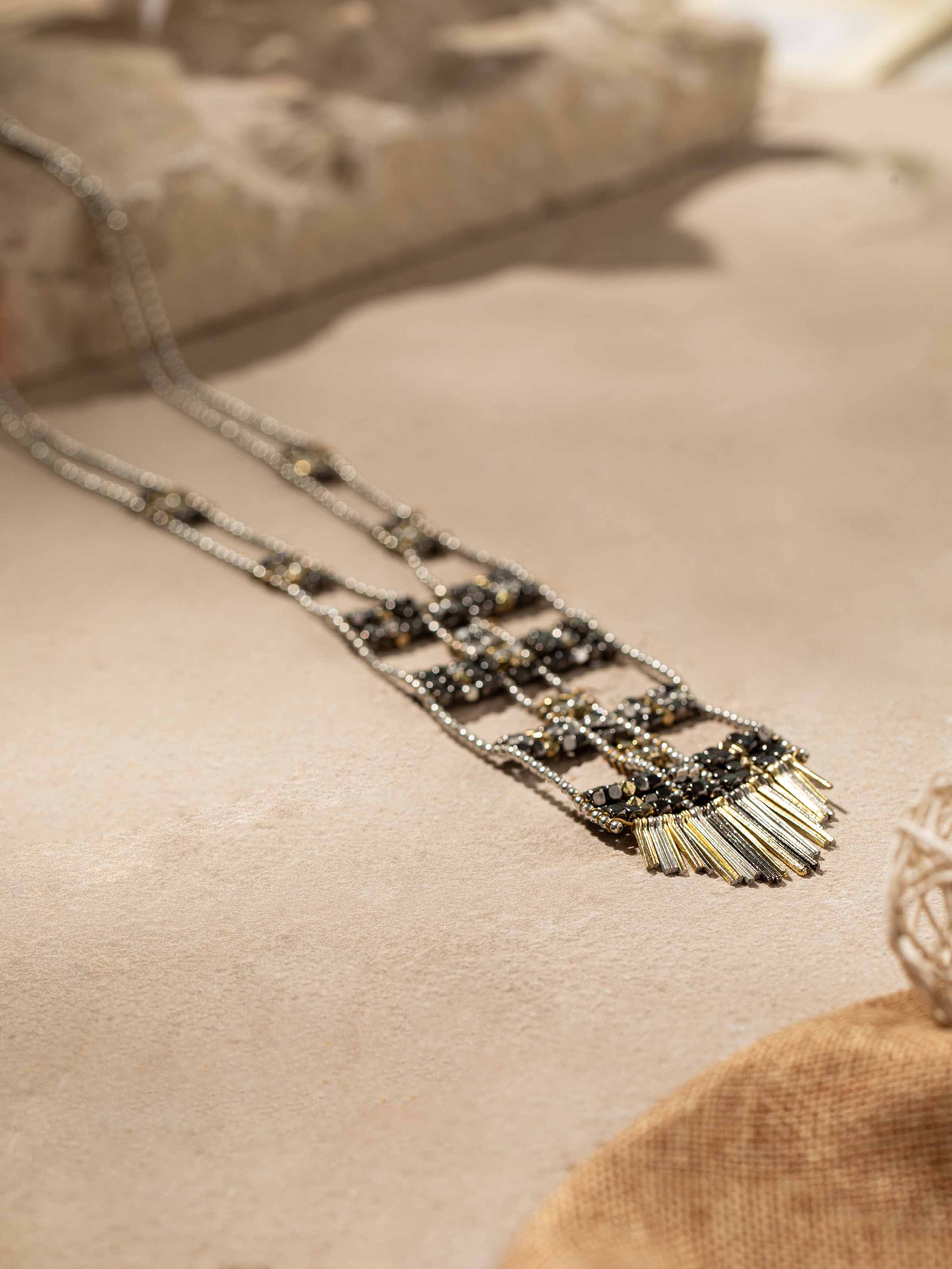 Detailed view of Handcrafted long necklace showcasing unique artistry and detailed design