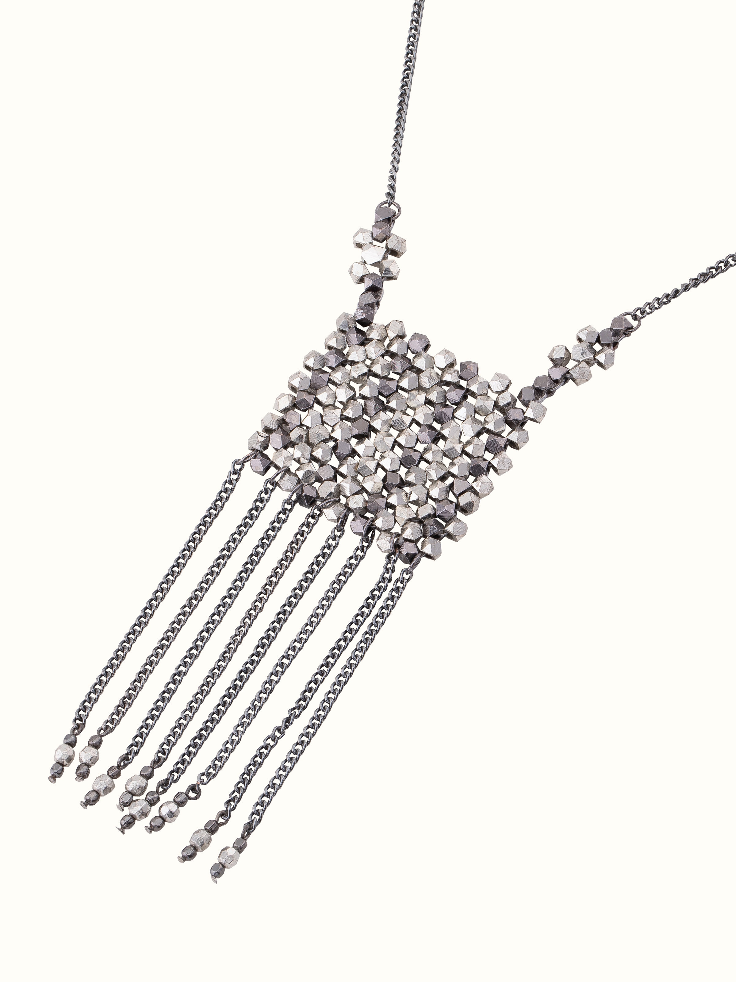 Angled view of handcrafted long necklace focusing on detailed design and craftsmanship