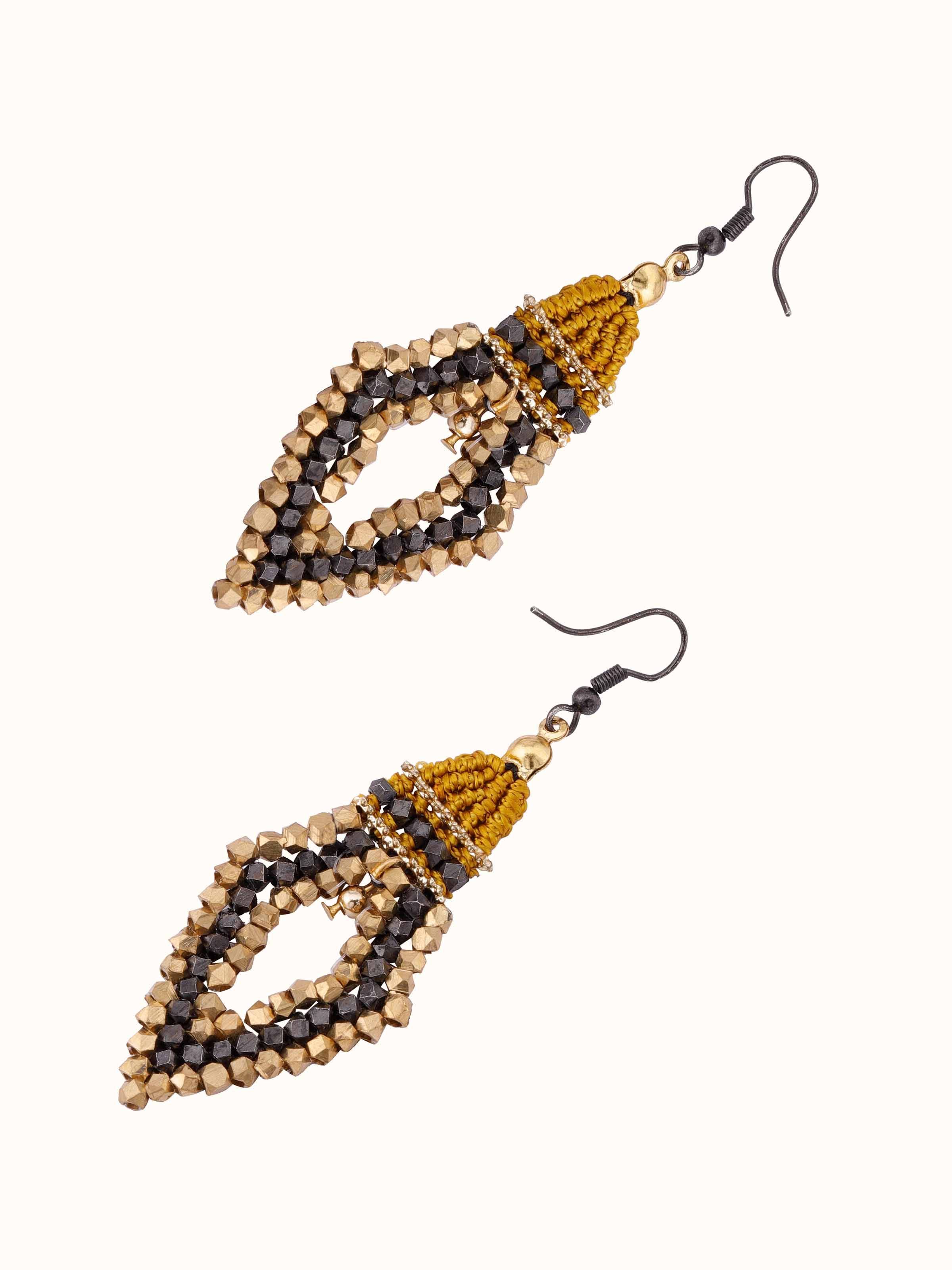 Overhead view of handcrafted drop earrings showing their full design and hanging style.