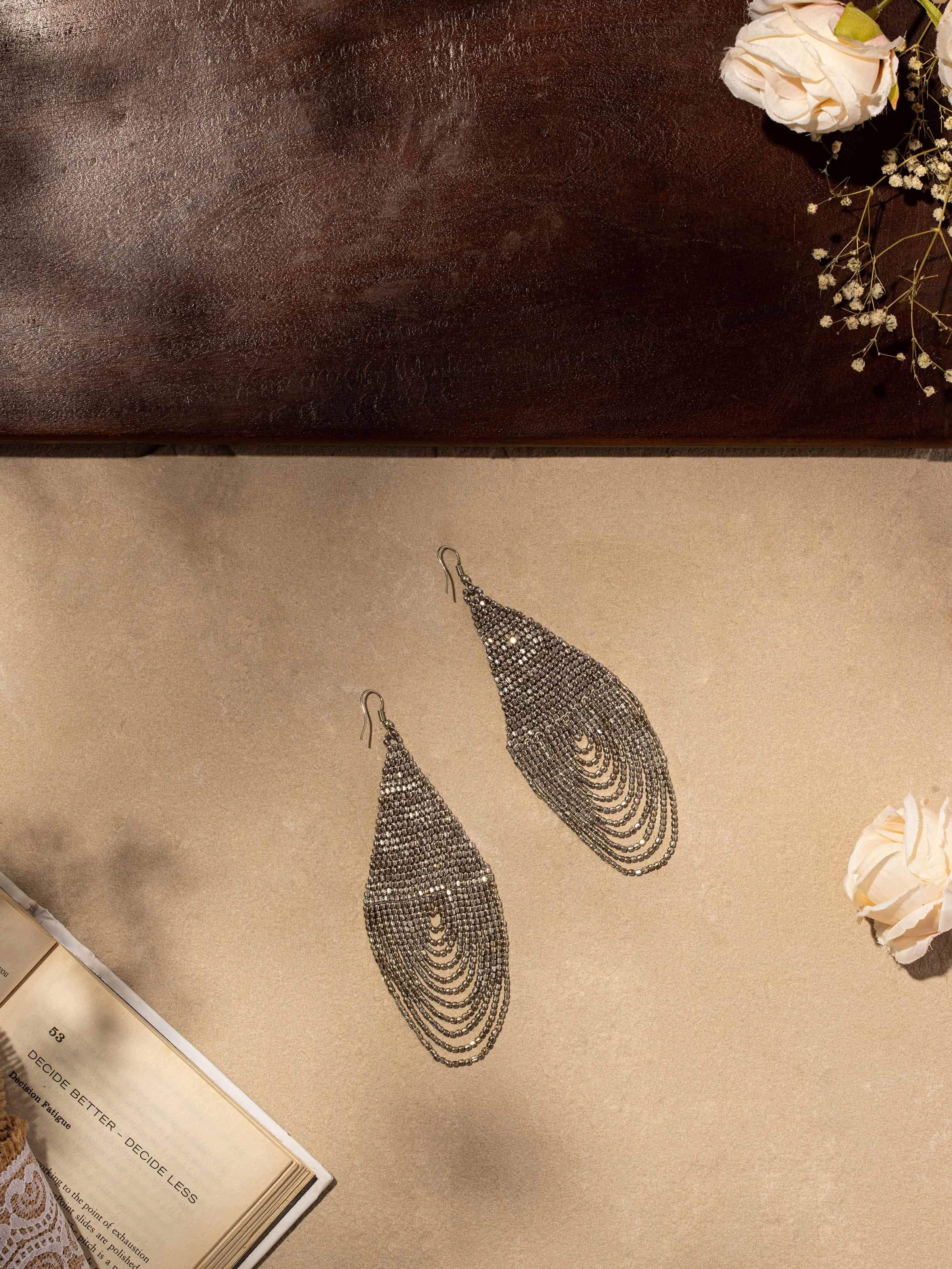 Side view of Handcrafted Drop Earrings highlighting the artisanal quality and detailed work.