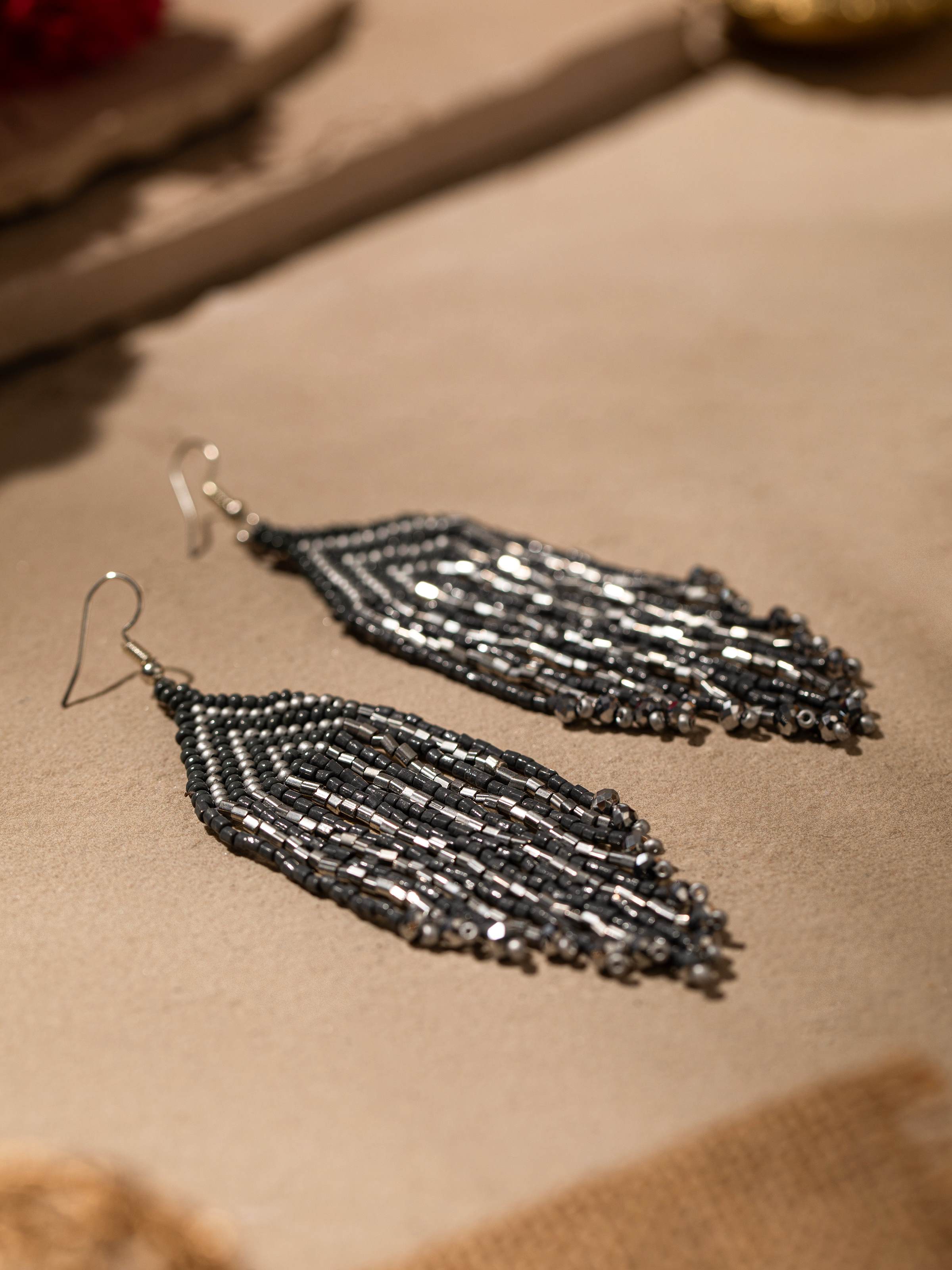 Detailed view of Handcrafted Drop Earrings with a focus on the intricate patterns and unique finish