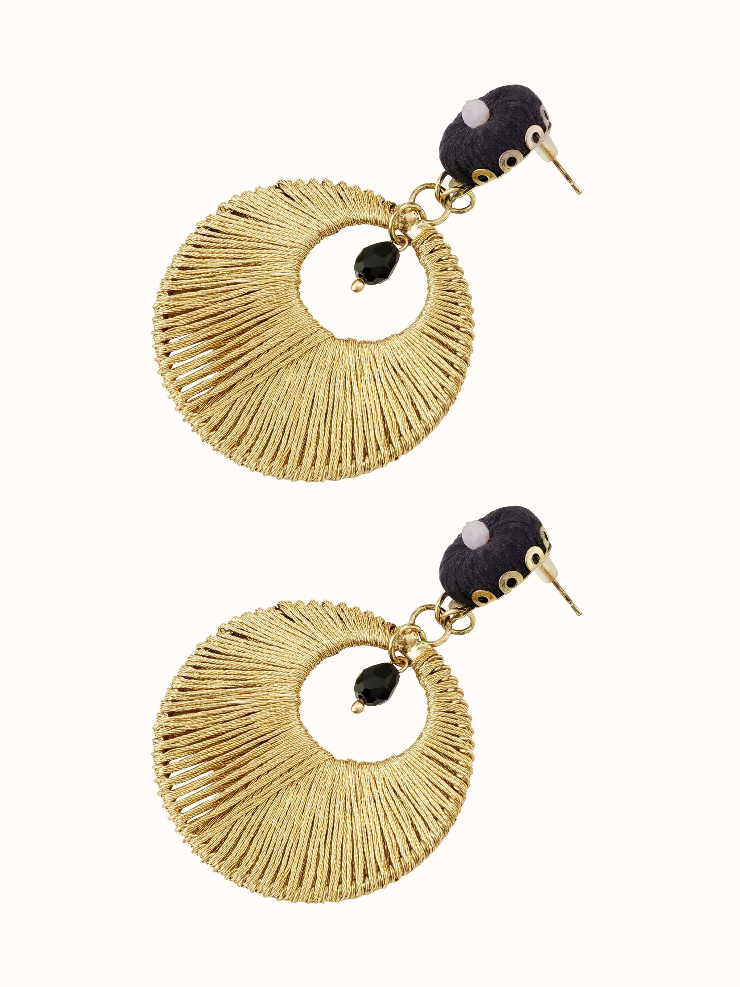 Handcrafted drop earrings displayed on a flat surface emphasizing the elegant design and detailed work.