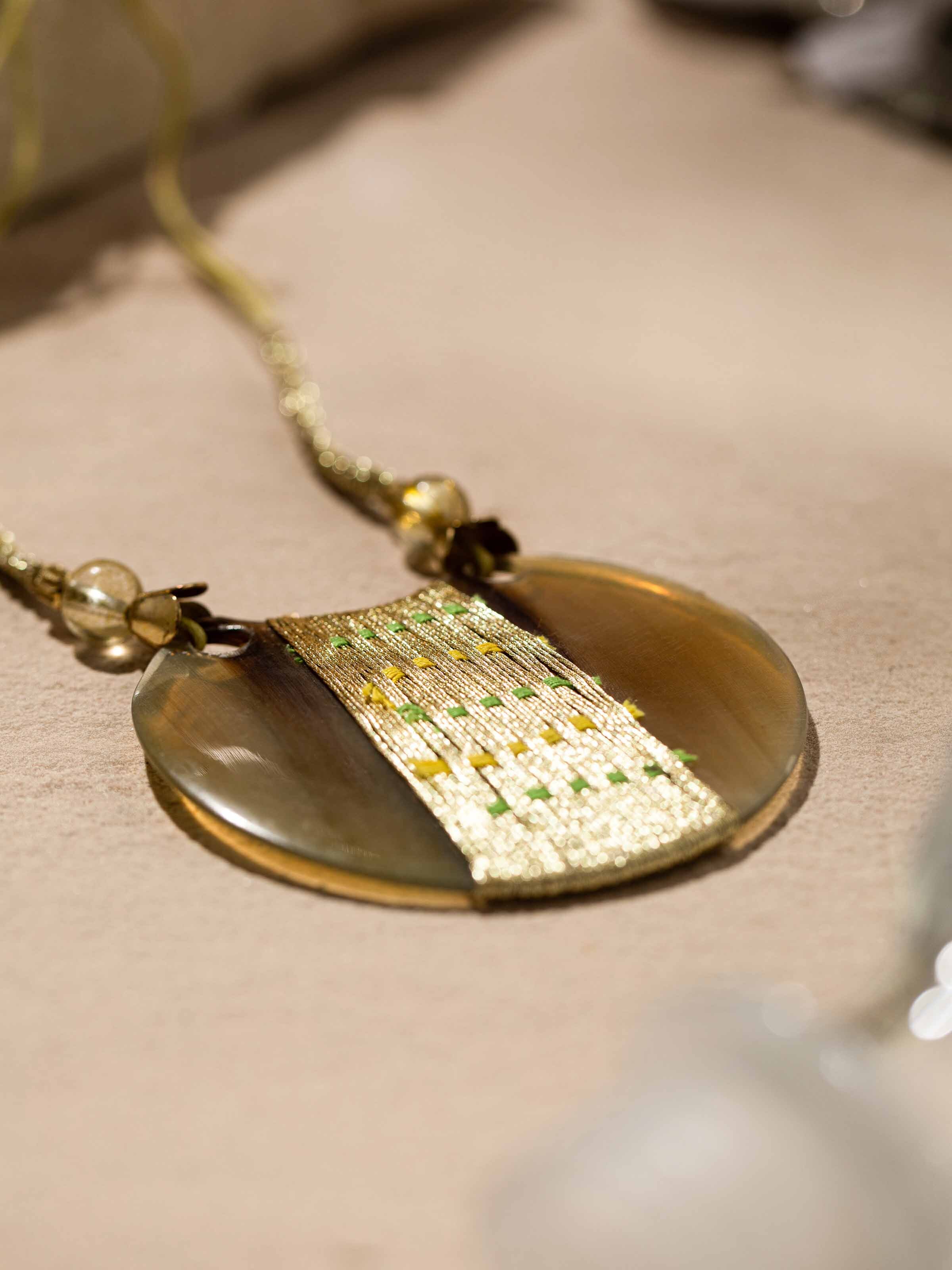 Detailed front view of handcrafted long necklace emphasizing its sophisticated design