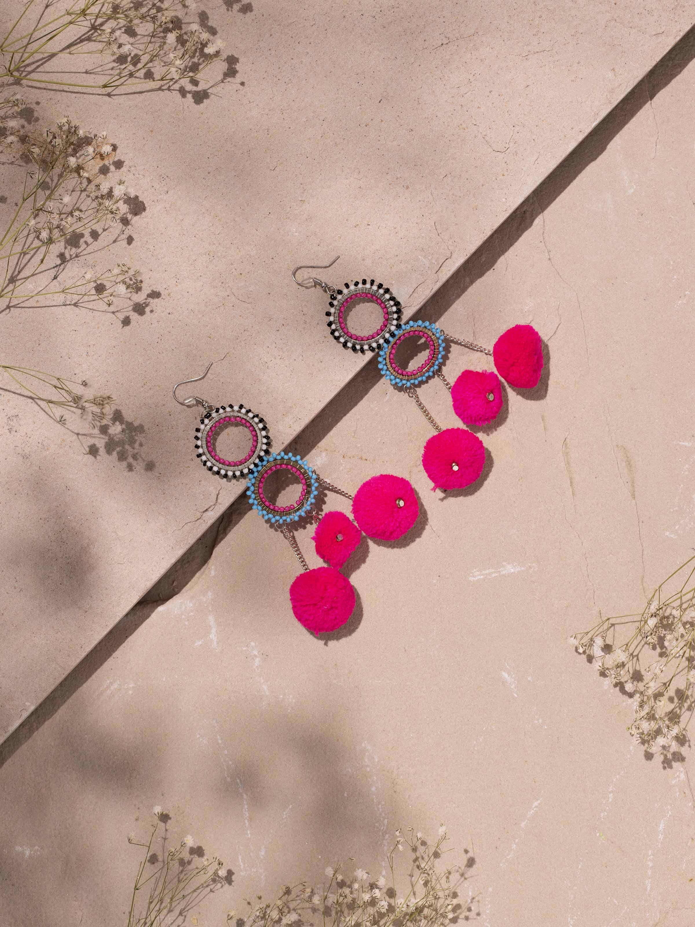 Side view of glass flamework silver long necklace emphasizing its length and design details.