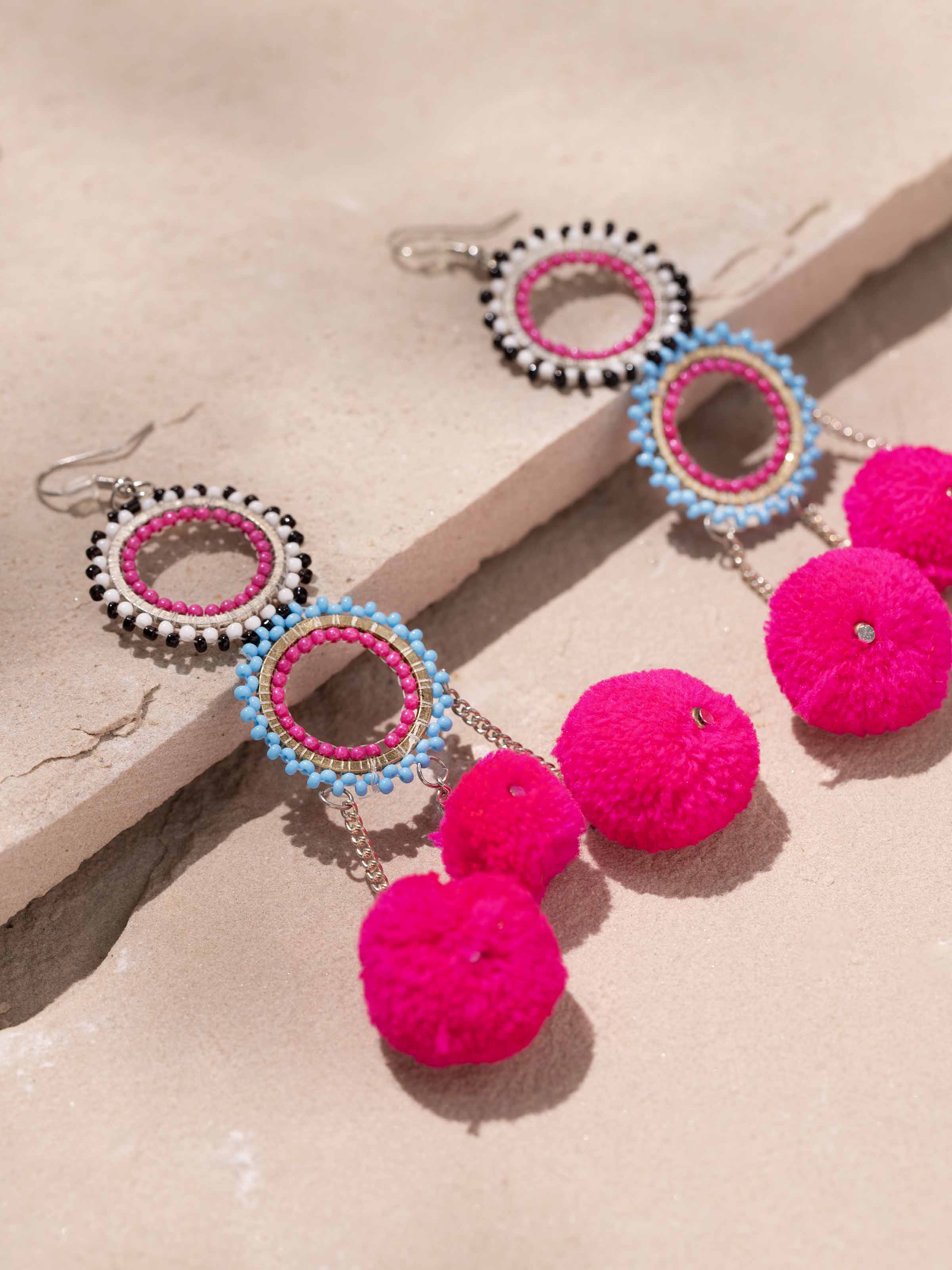 Close-up view of glass flamework silver long necklace highlighting intricate glasswork.