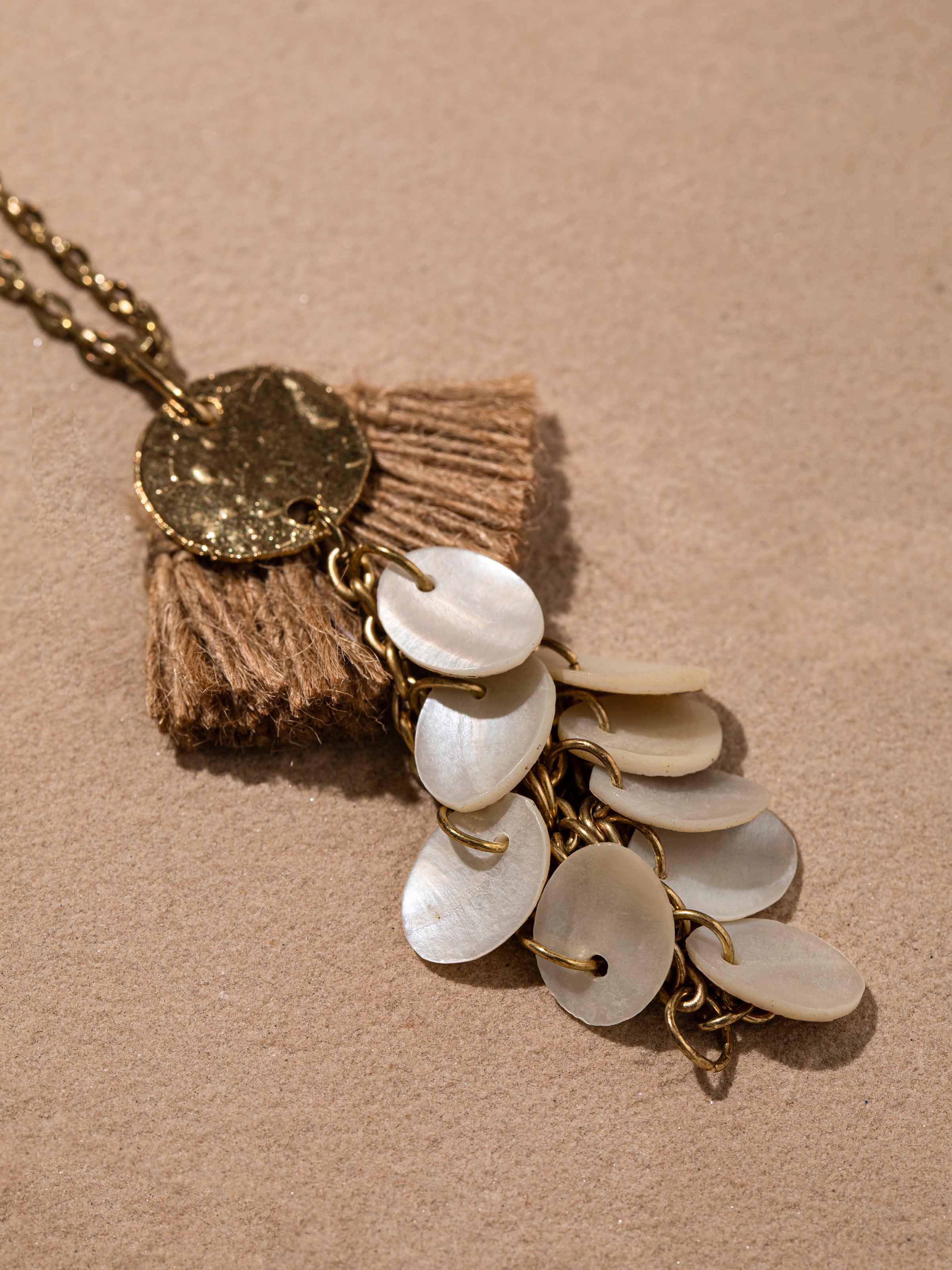 Detailed close-up of handcrafted long necklace showcasing the fine details and craftsmanship.