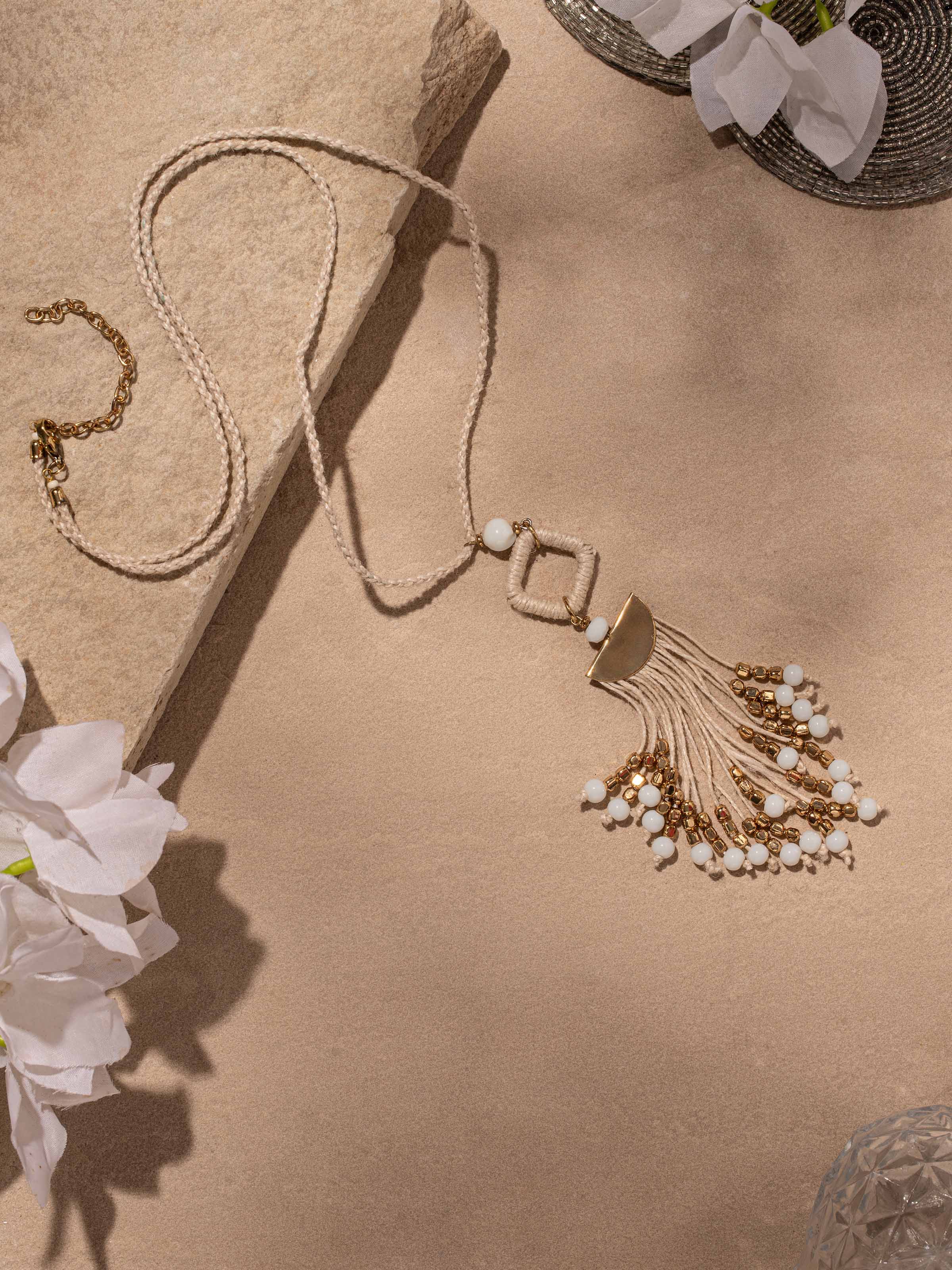 Close-up of handcrafted long necklace highlighting fine detailing and elegant design