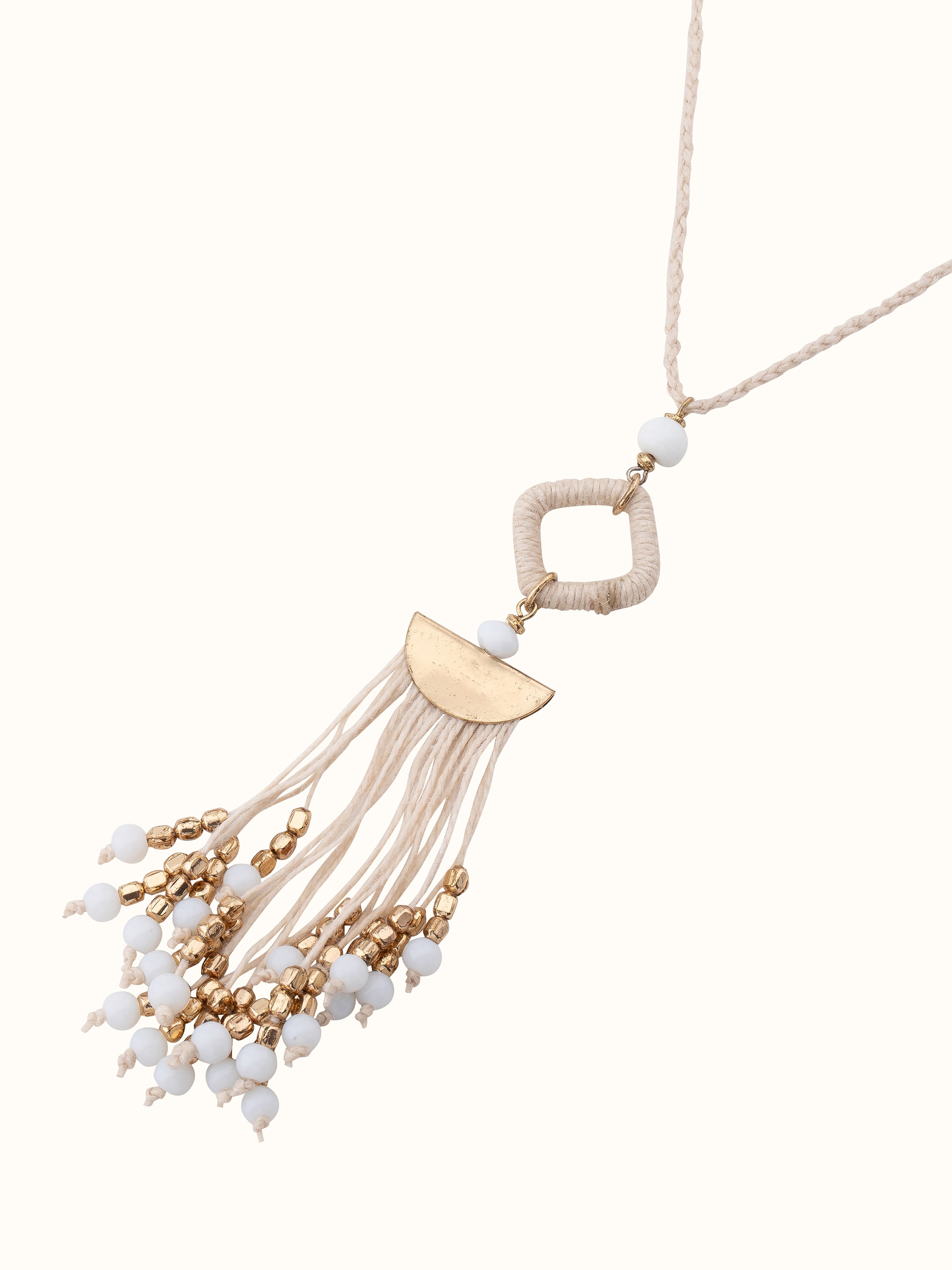 Overhead view of handcrafted long necklace displaying intricate design and artistic embellishments