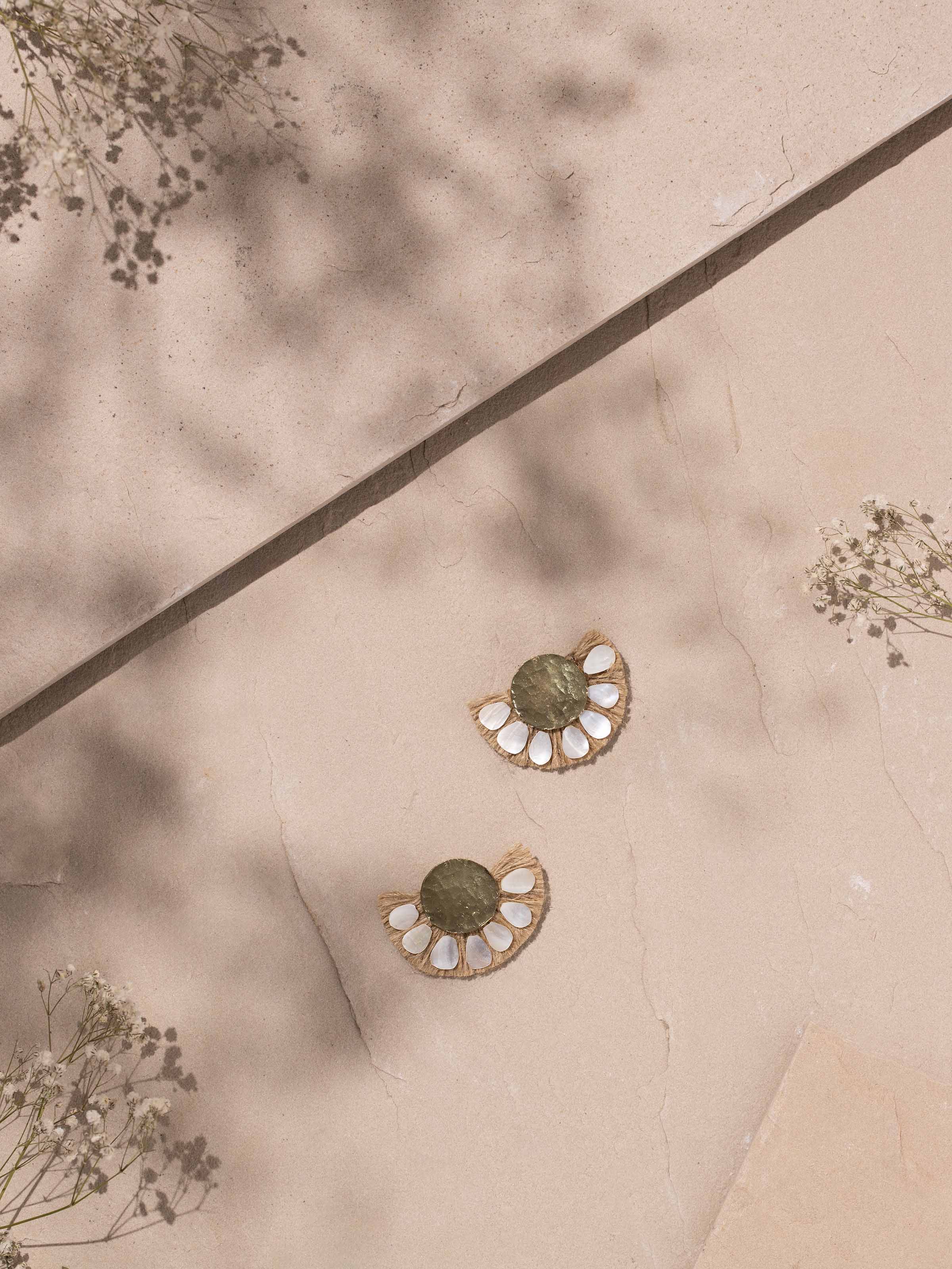 Side view of Handcrafted Drop Earrings displaying elegant design and craftsmanship.